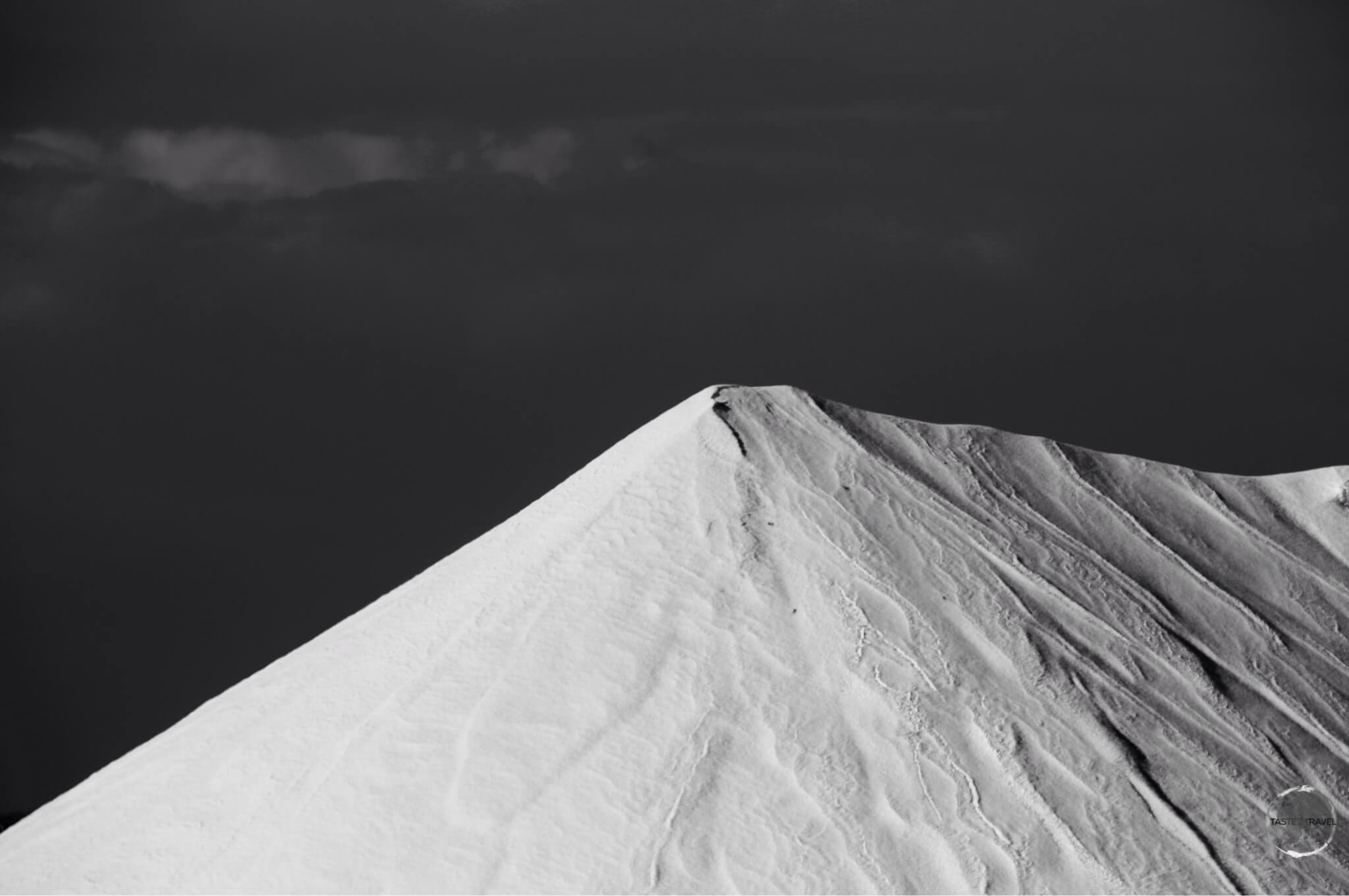 The salt heaps at the Cargill Salt Mine look like snow covered mountains.