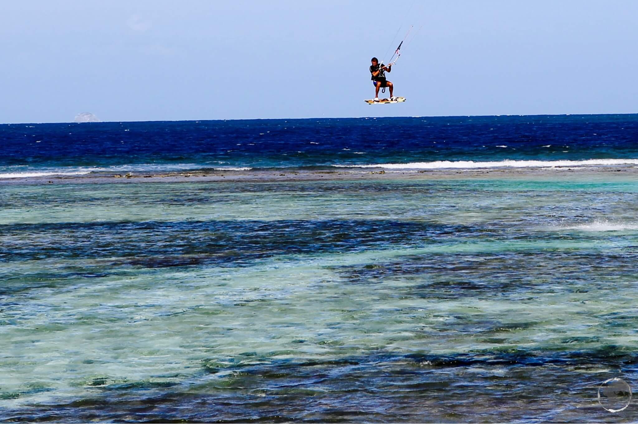 A kite surfer, taking advantage of a strong breeze on Union island.