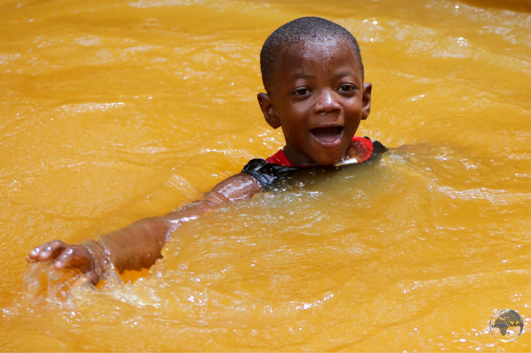 A local boy enjoying a swim in the Soufriere Sulphur Springs.