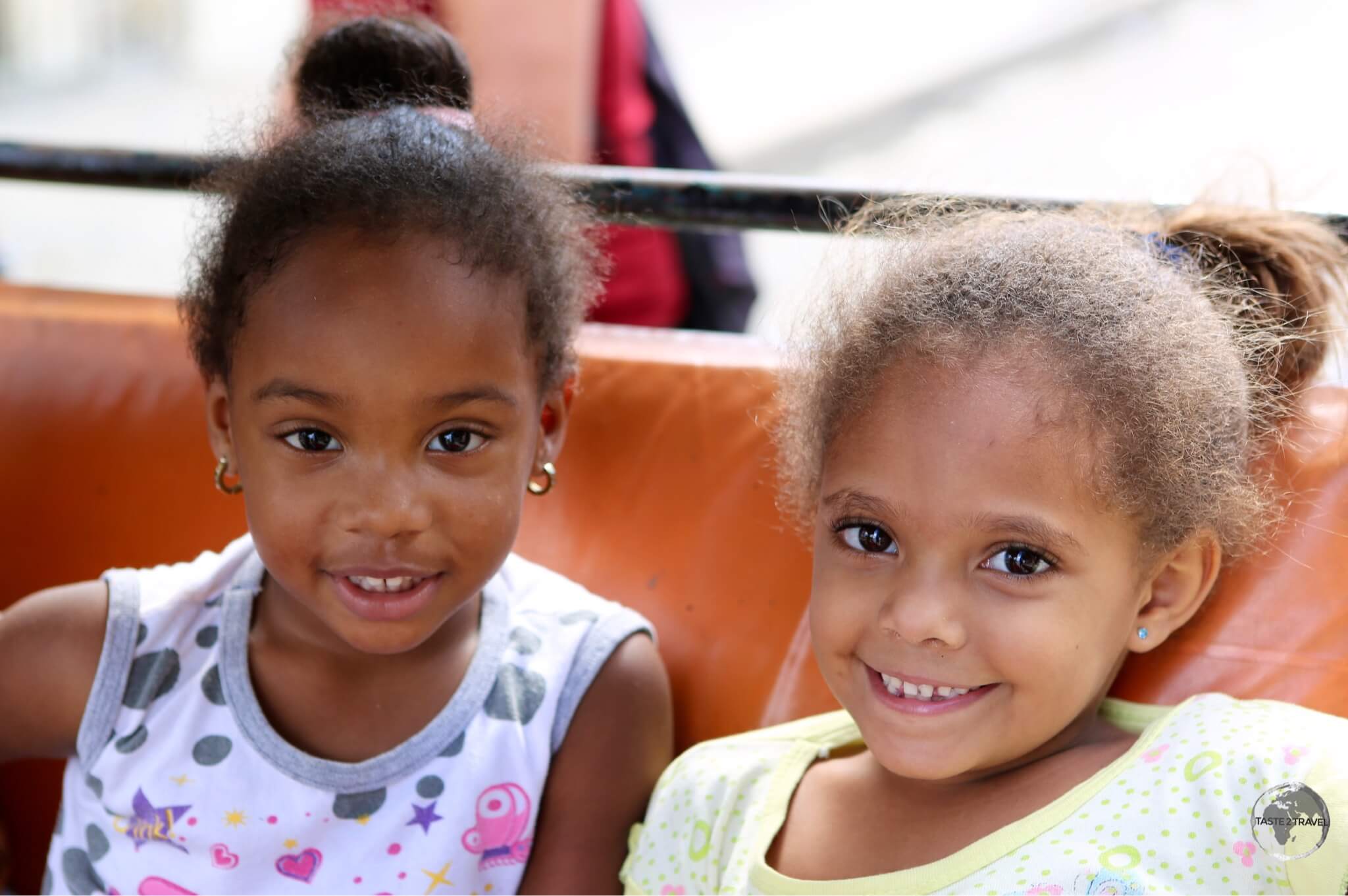 Two young girls in Cienfuegos enjoying an outing in a Bicitaxi.