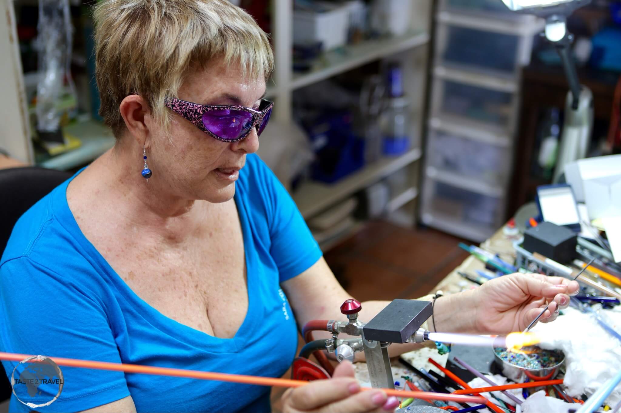 Saba Travel Guide: Jo Bean giving instruction during her glass-bead making class. 