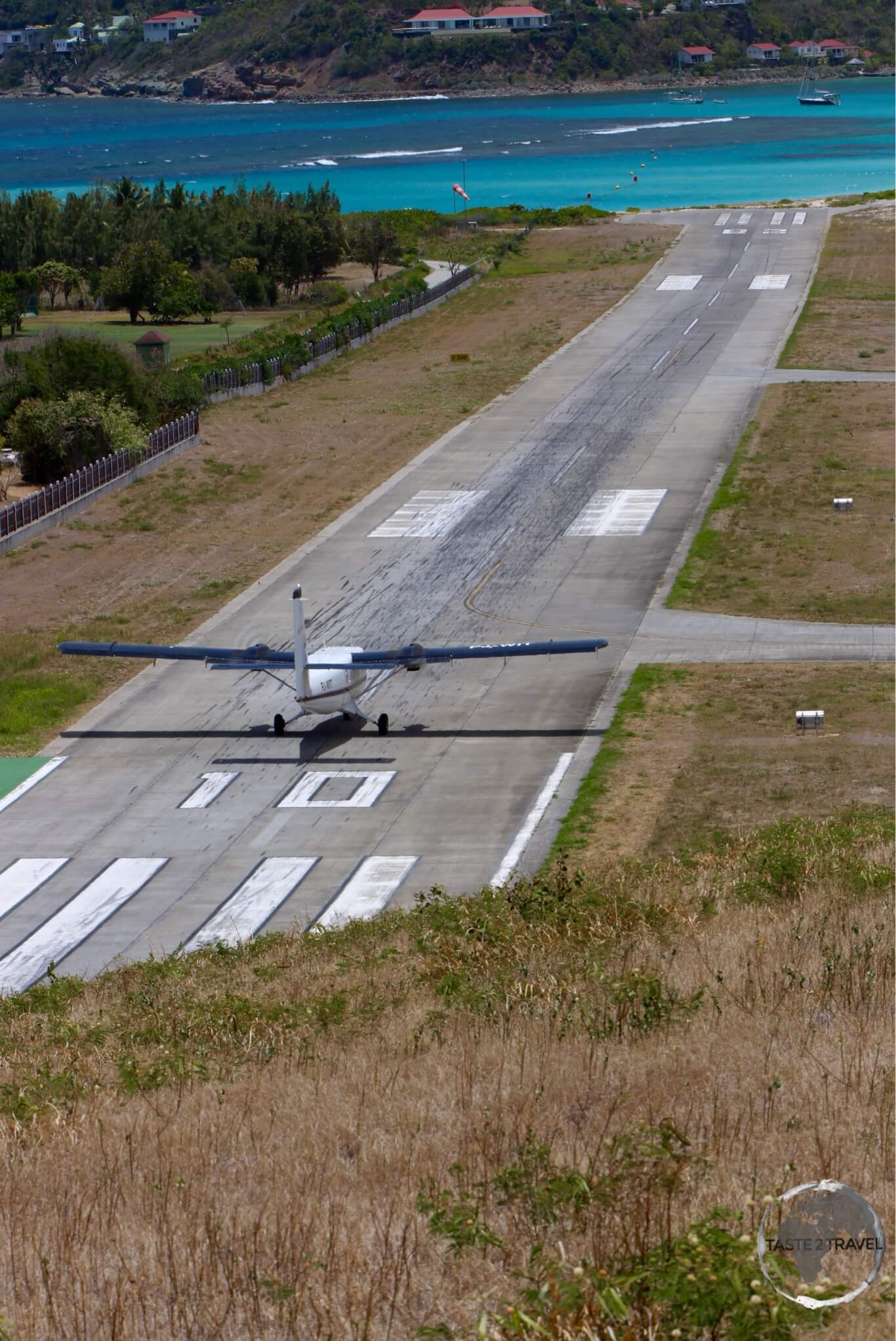 A Winair flight from St. Martin, landing on the very short runway at St. Barts.