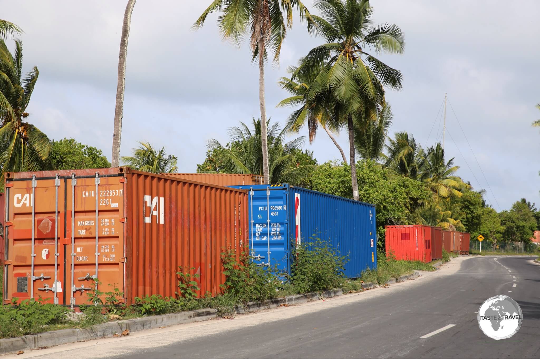 Discarded shipping containers line the streets on Betio Island. There is no real port facility so the containers are left on the roadside and are used for storage by local shop owners. 