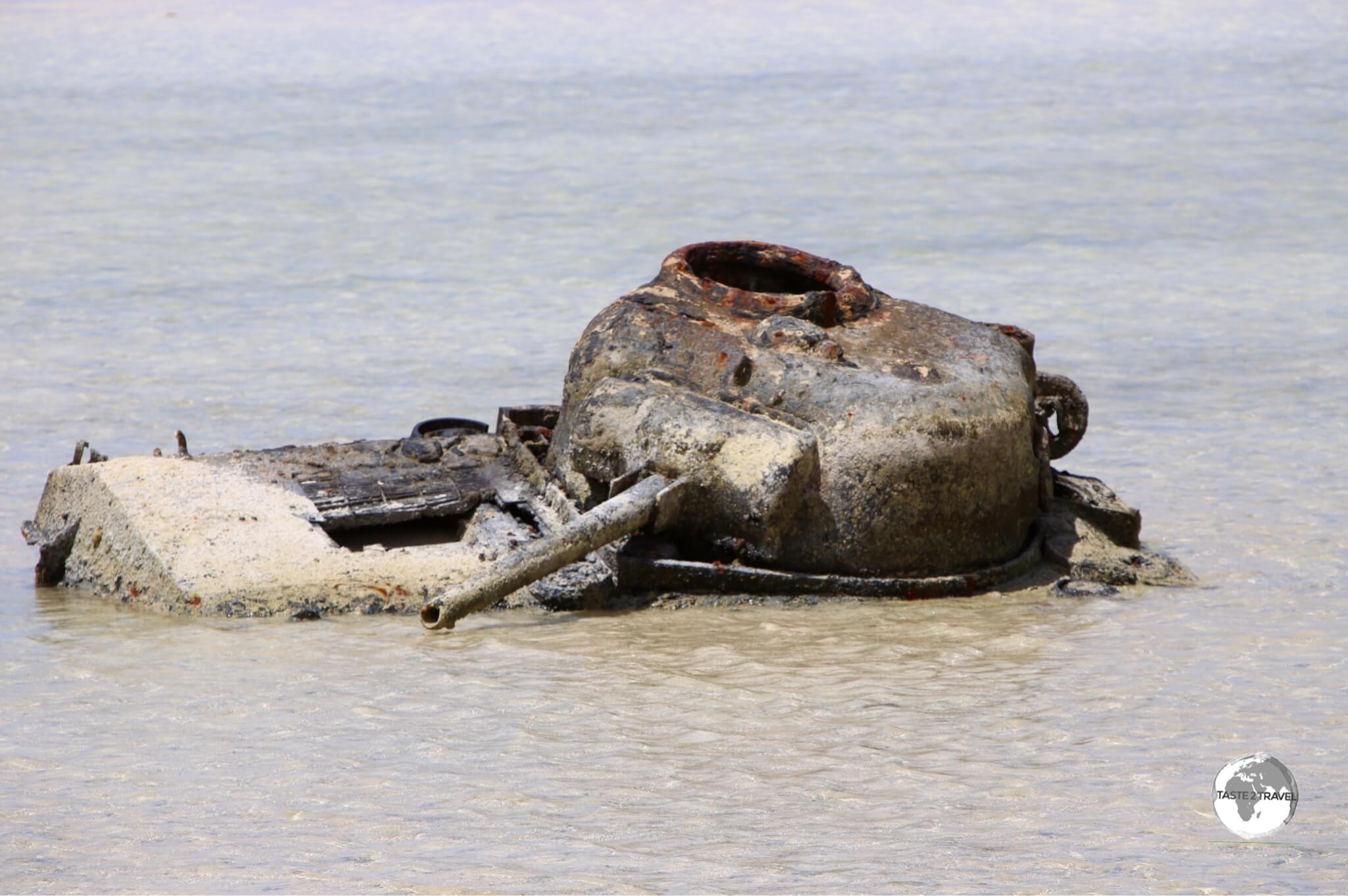 A wrecked Sherman tank laying in the sand on Betio Island.