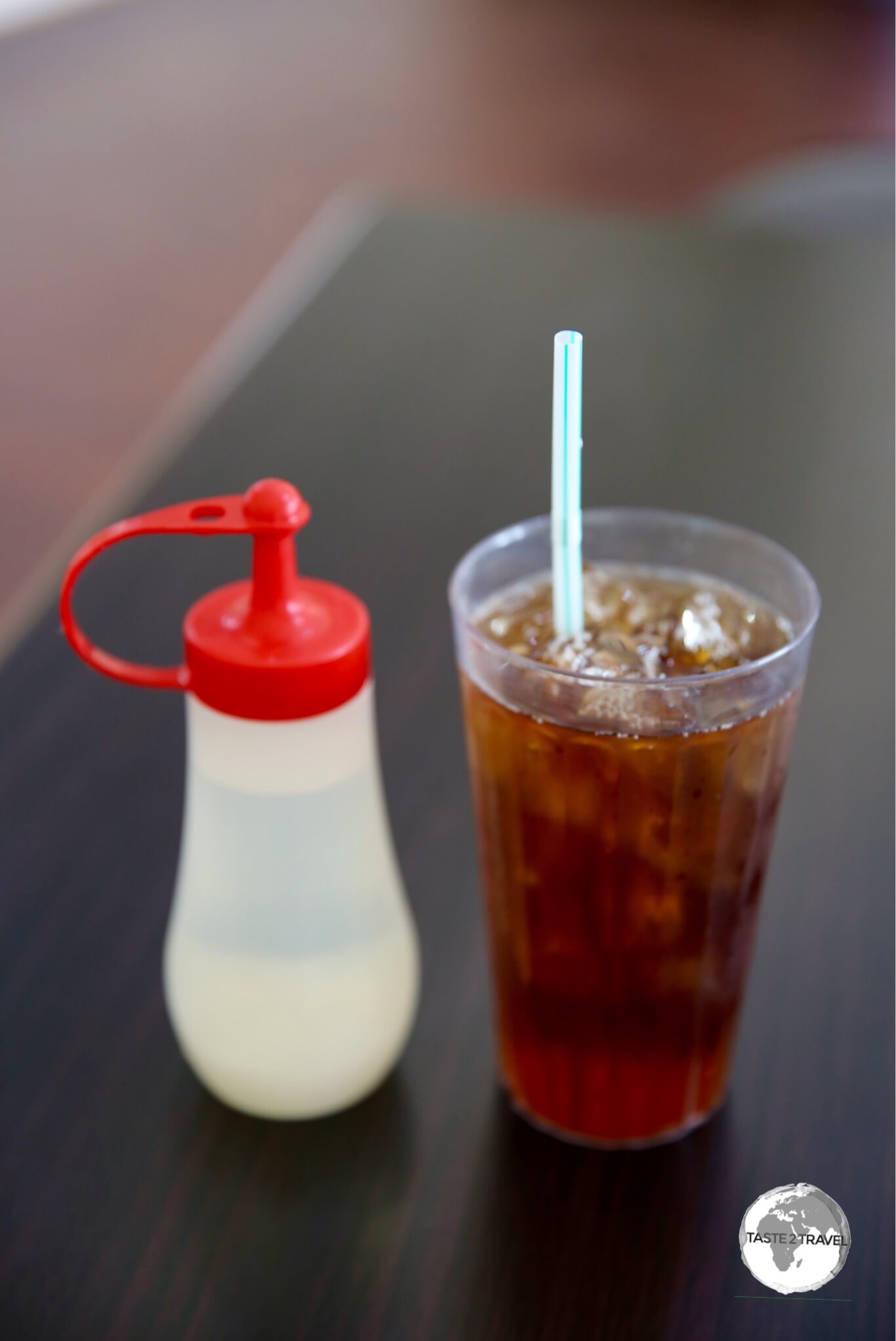 Iced Tea served with simple syrup on the side in a cafe in Kolonia.