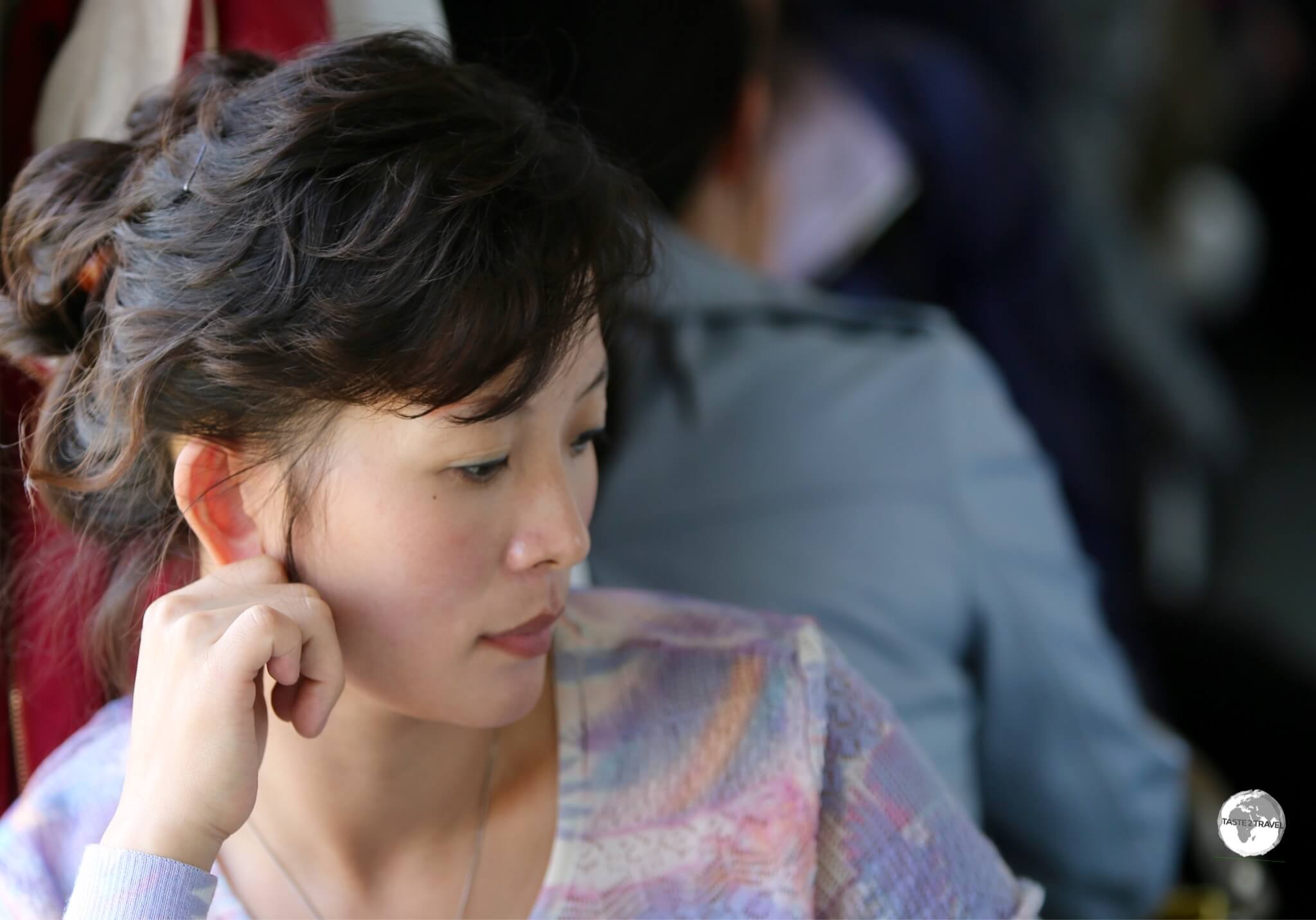 Deep in thought - a North Korean passenger on the train from Sinuiju to Pyongyang, 