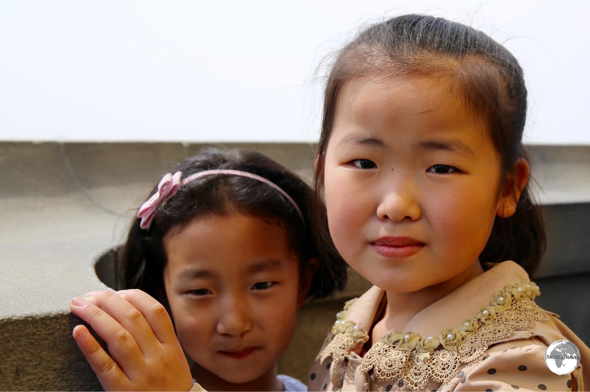 Young girls enjoying the views of Pyongyang from the top of the Juche Tower.