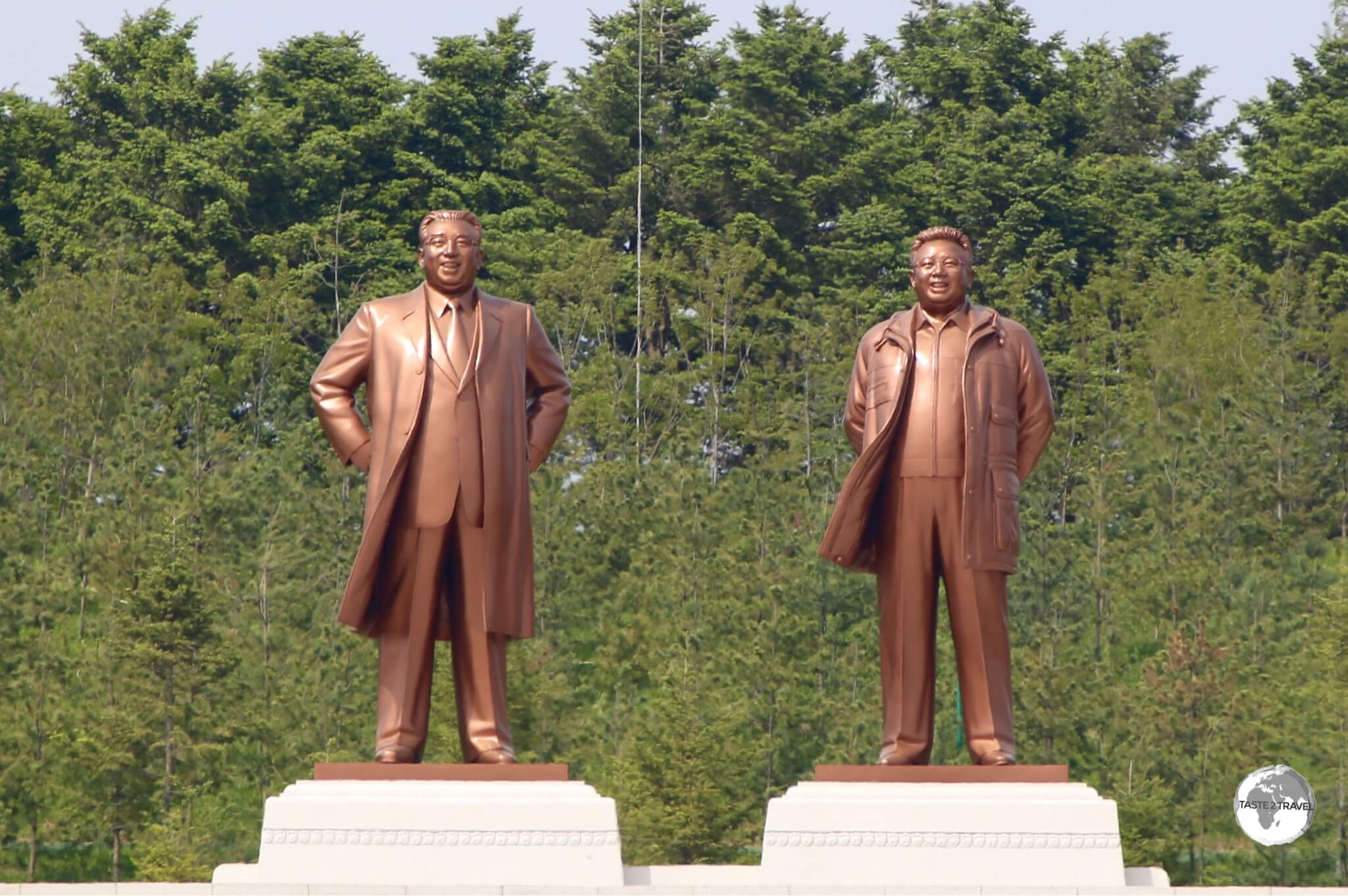 Statues of Kim Il-sung and Kim Jong-il, which overlook the city of Kaeson.