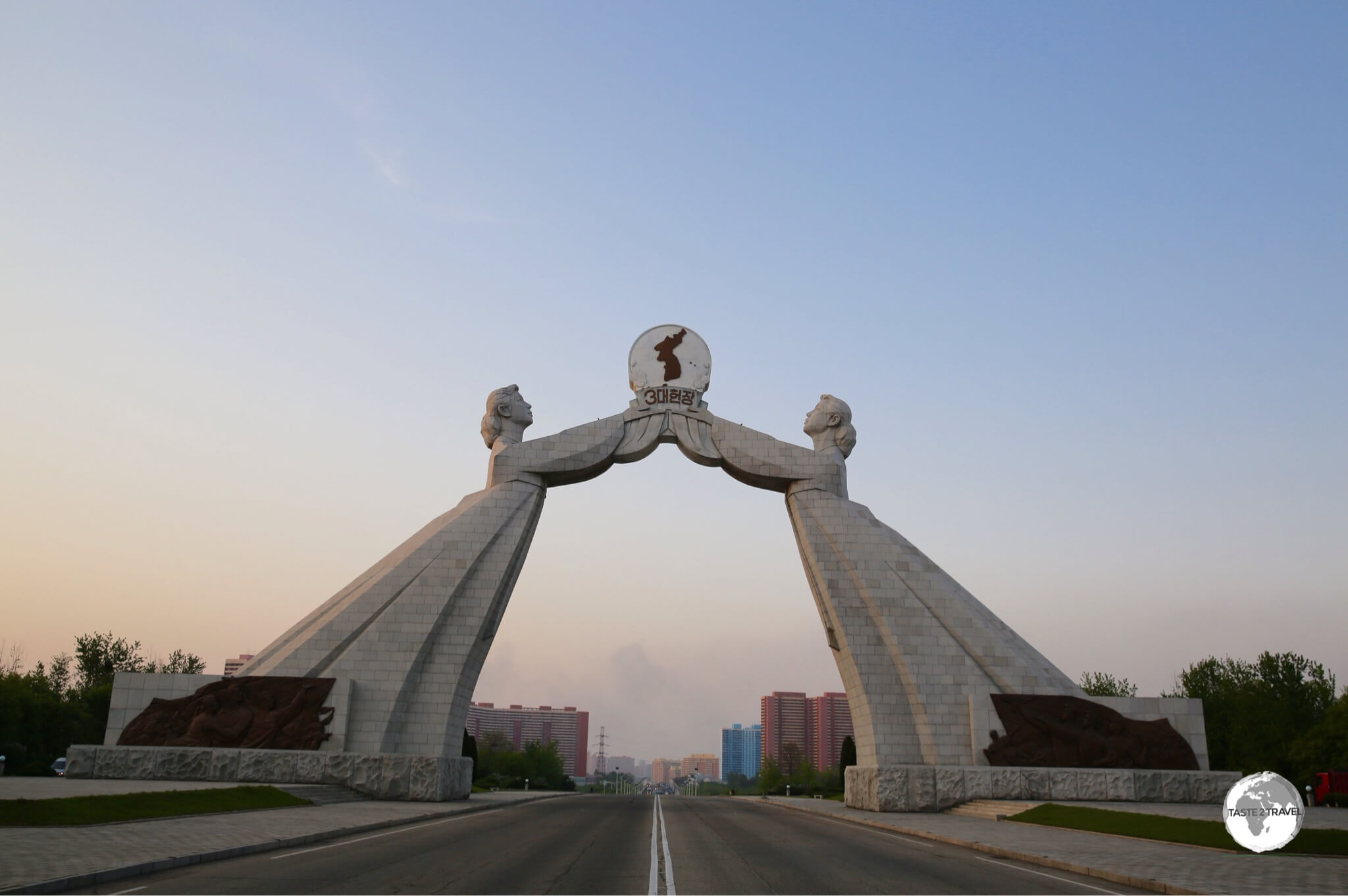 Located on the outskirts of Pyongyang, the Reunification Arch spans the Reunification highway which connects the capital with the DMZ.