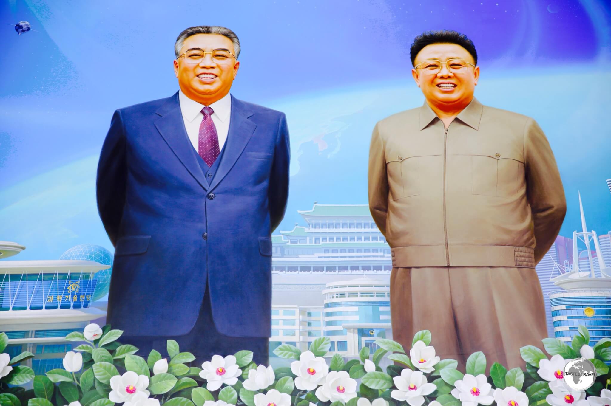 An idealised portrait of the DPRK leadership at the Science &amp; Technology complex in Pyongyang.