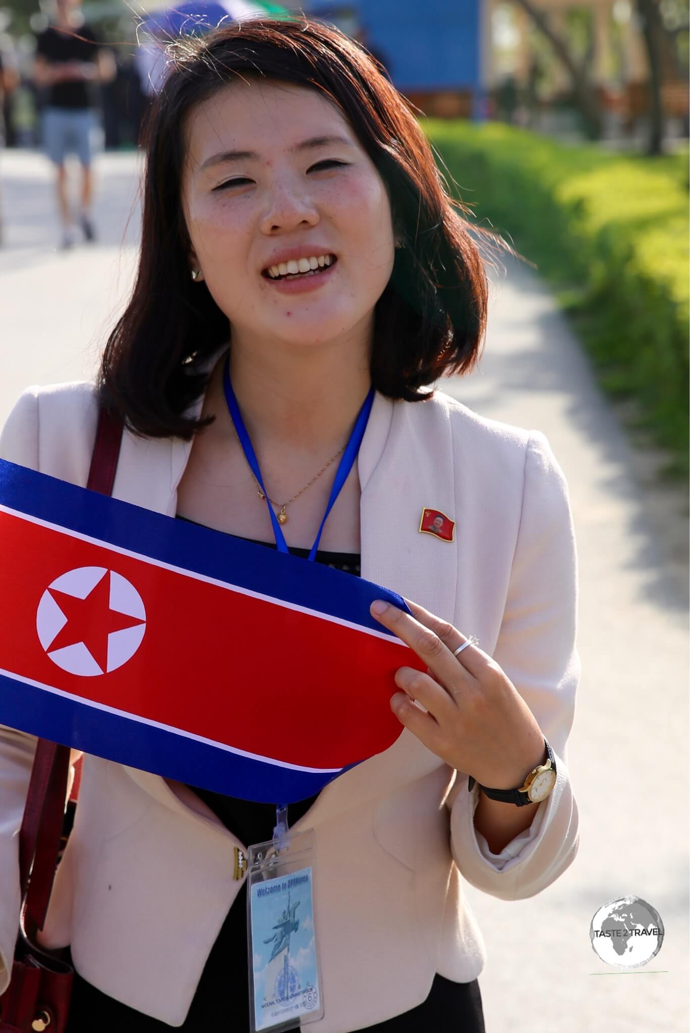 Our wonderfully unflappable KITC guide, holding my souvenir DPRK flag, at Pyongyang Zoo.