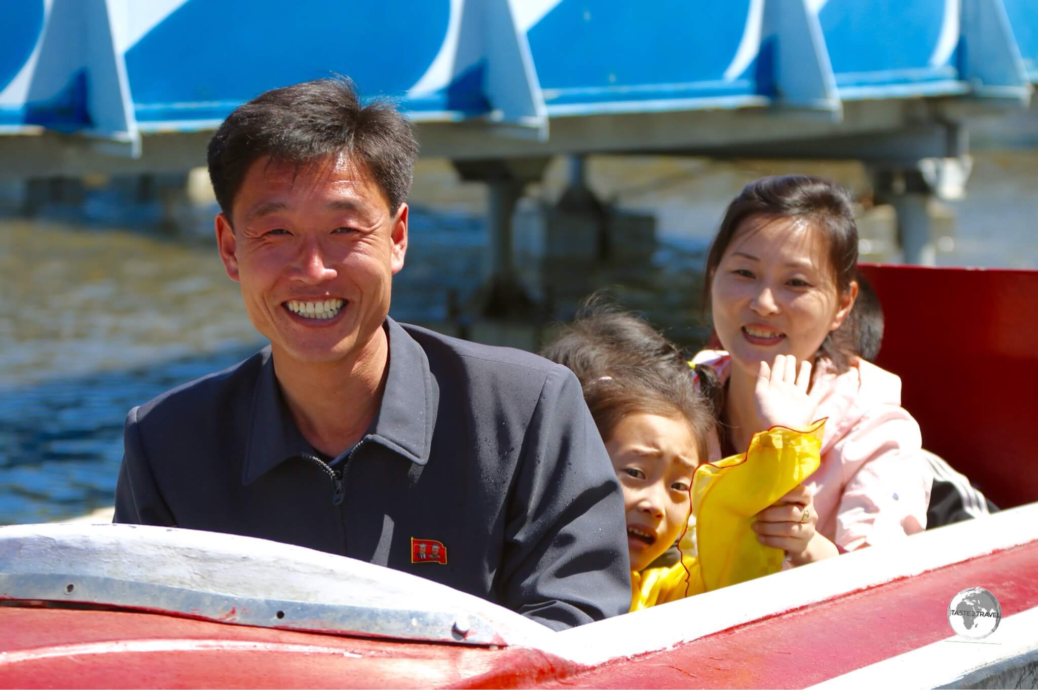 A family enjoying the splash boat ride at Taesongsan Fun Fair in Pyongyang