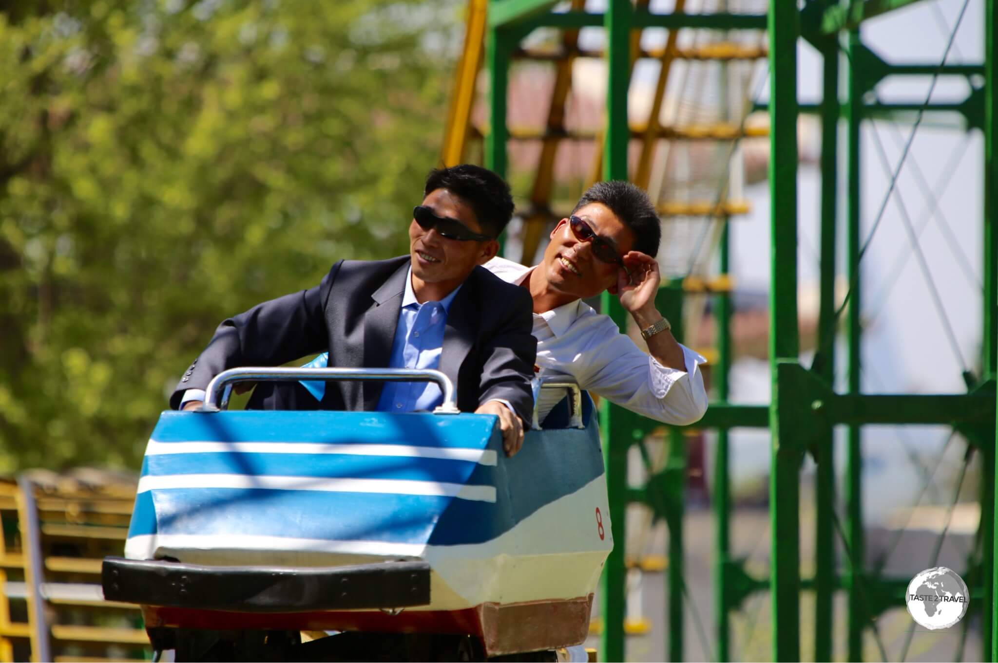 North Koreans enjoying a free roller coaster ride at Taesongsan Fun Fair.