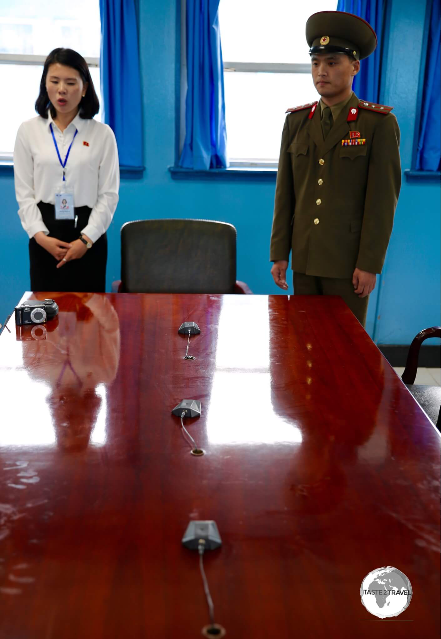 This table sits directly on the border between North and South Korea, with the line of microphones marking the border. While in the room you are free to move around the table, from North to South Korea.