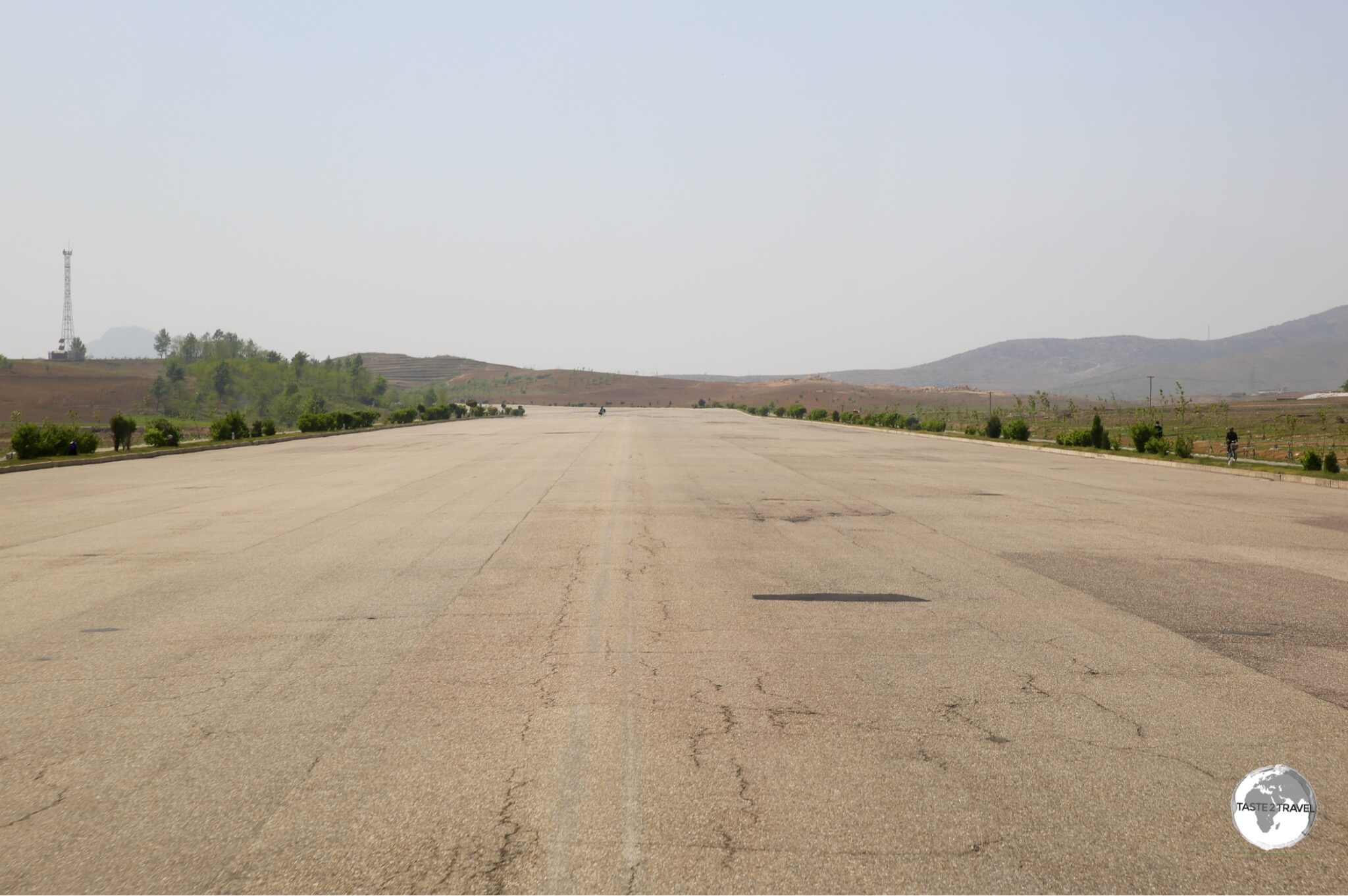 The wide, empty expressway connecting Pyongyang to Nampo is typical of roads in North Korea - completely free of traffic. 