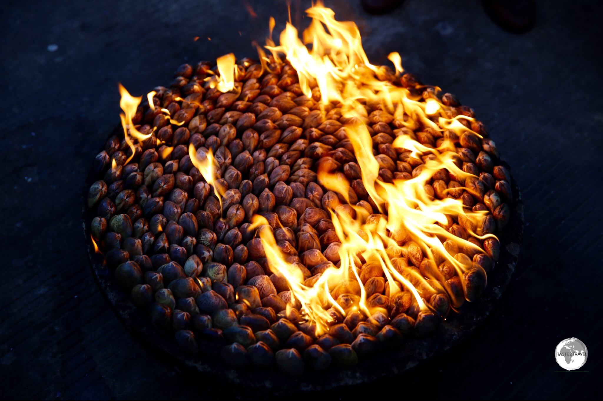 As the sunset at the Ryonggang Spa Resort in Nampo, the shells of the petrol clams had become blackened and were almost ready to savour!