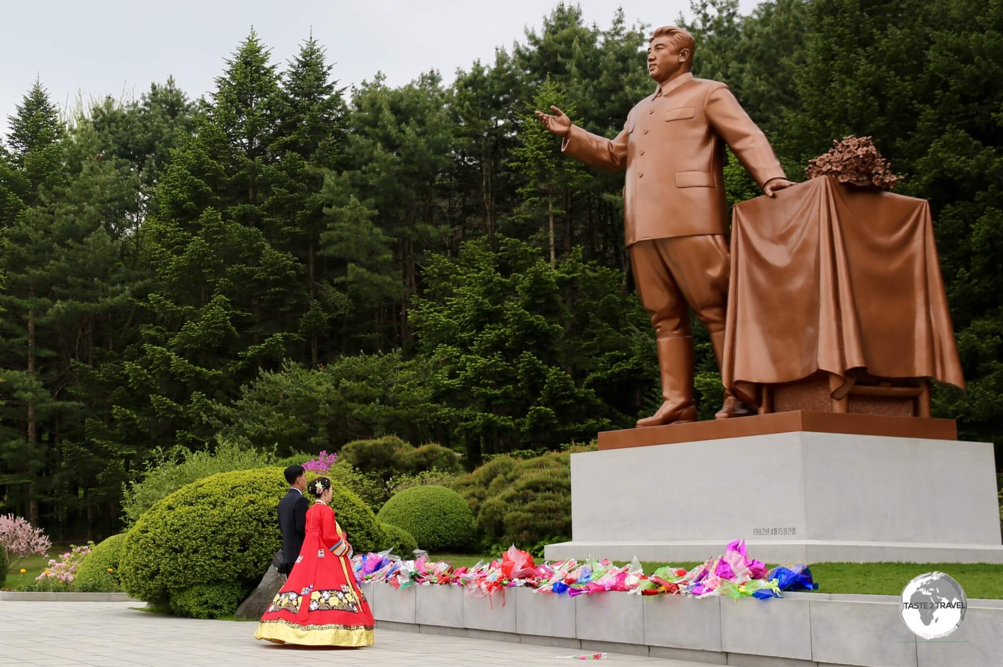 On their wedding day, all newlyweds are required to pay their respects to the <i>Dear Leader</i>, Kim Il-sung, by laying flowers at their nearest statue.