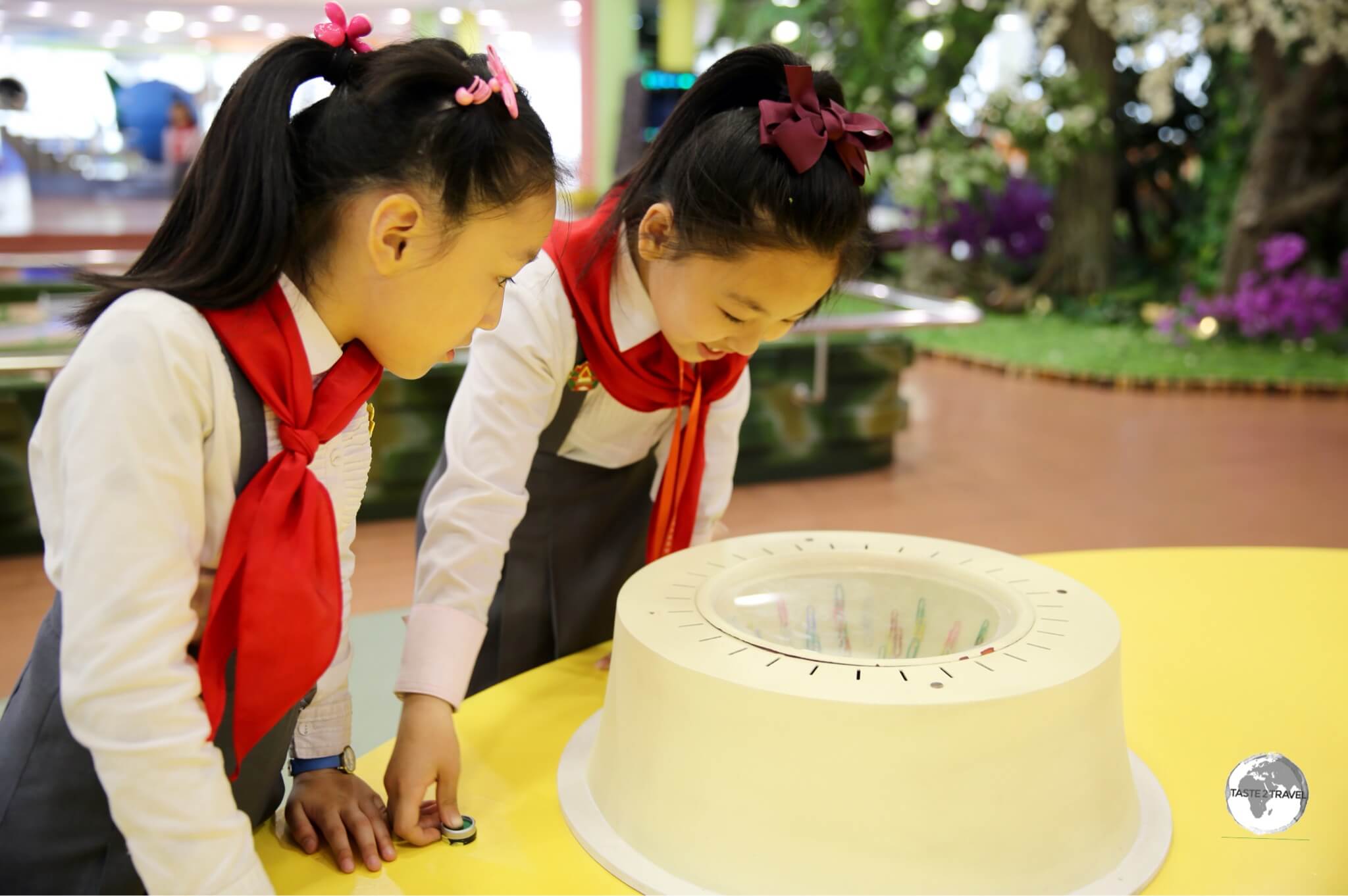 School girls exploring the interactive displays at the DPRK Sci-Tech Complex in Pyongyang.