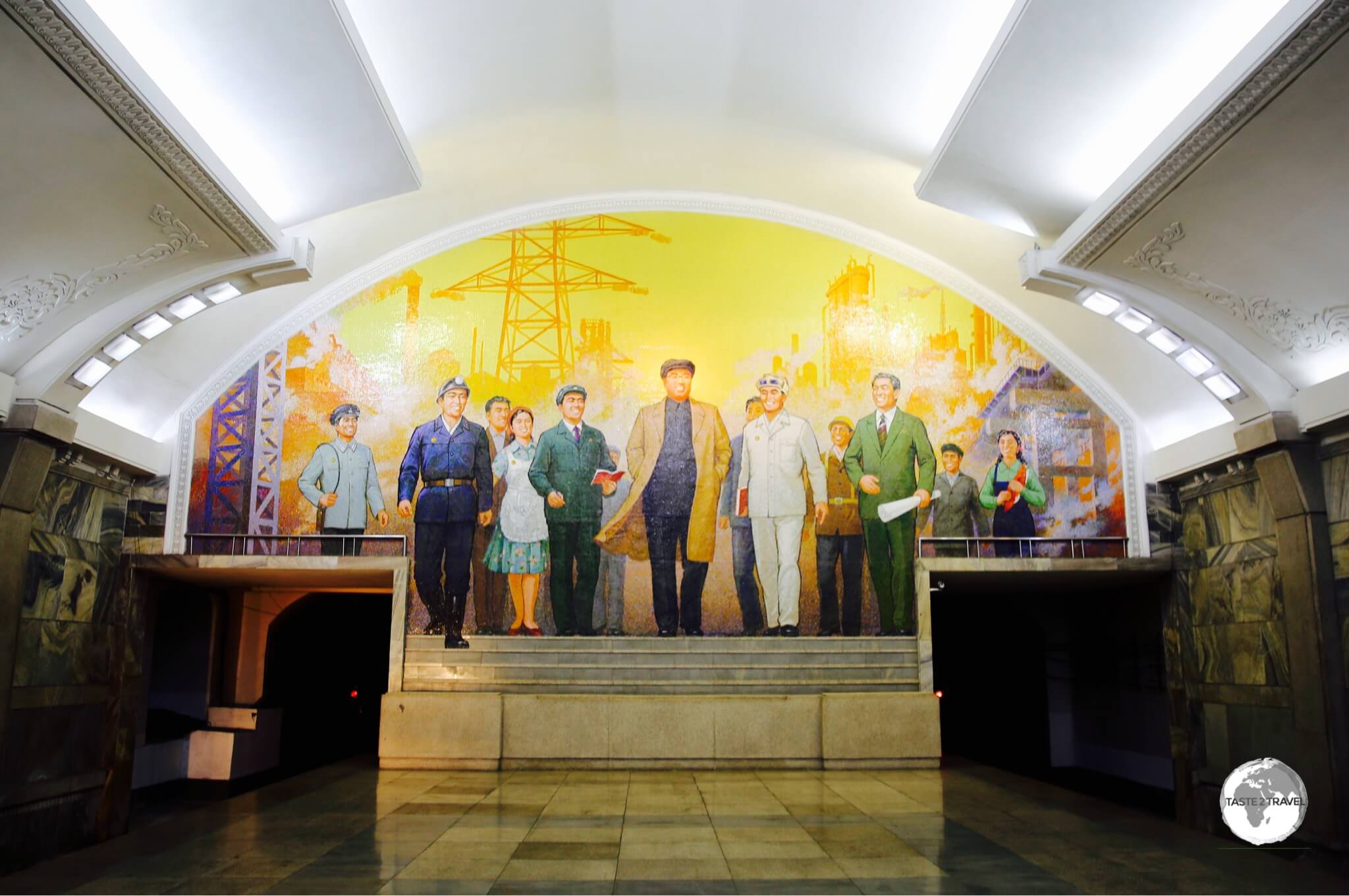 One of the key stations on the Pyongyang metro, Puhung station features a mural entitled <i>The Great Leader Kim Il-Sung Among Workers</i>.