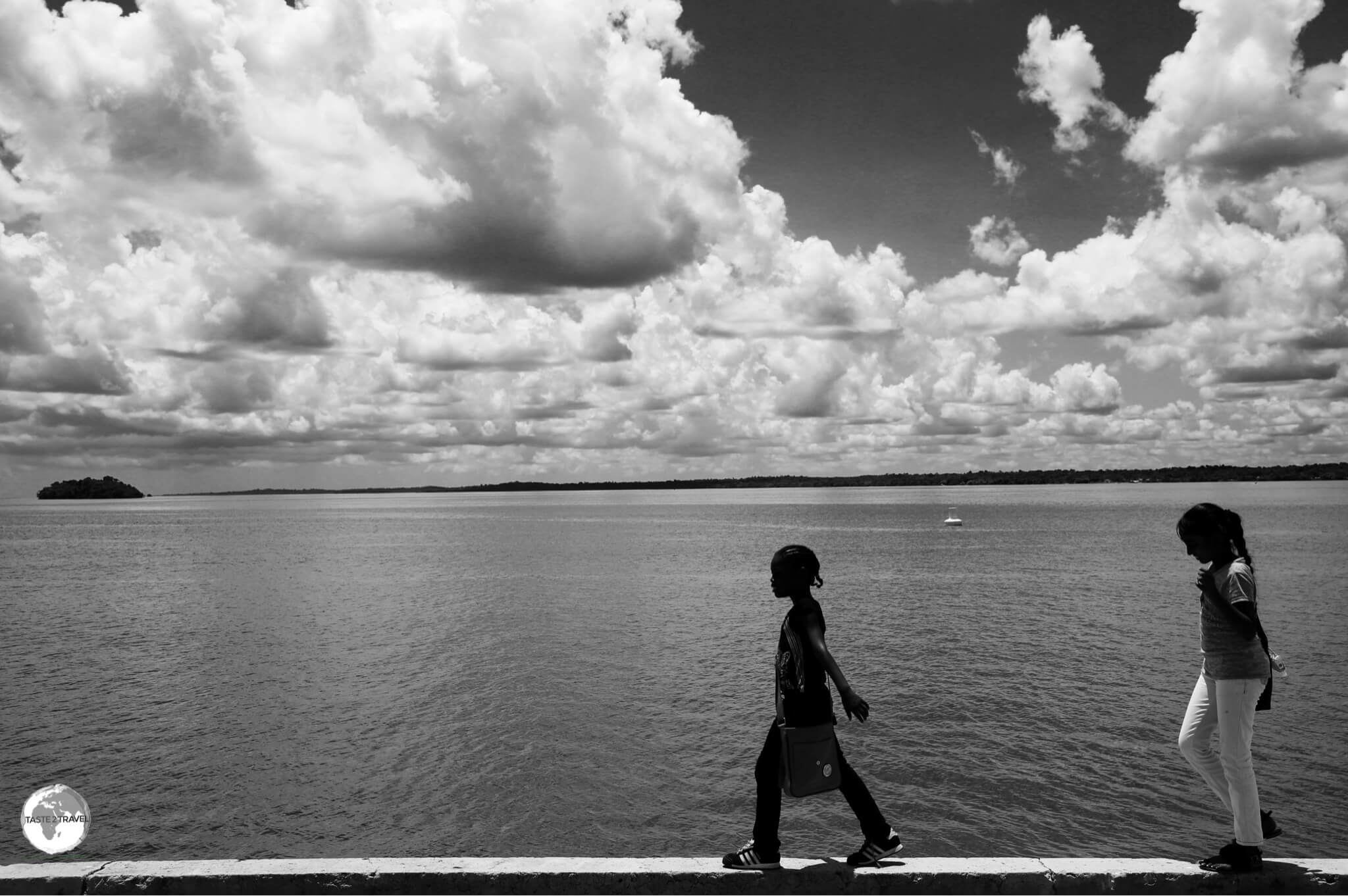 Girls walking along the bank of the Essequibo river in Bartica.