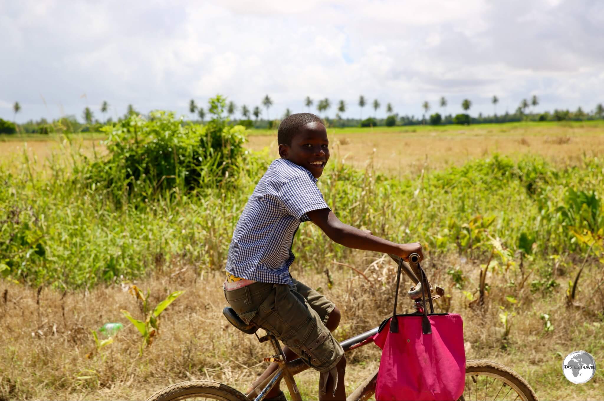 A young cyclist racing our taxi on Wakenaam Island.