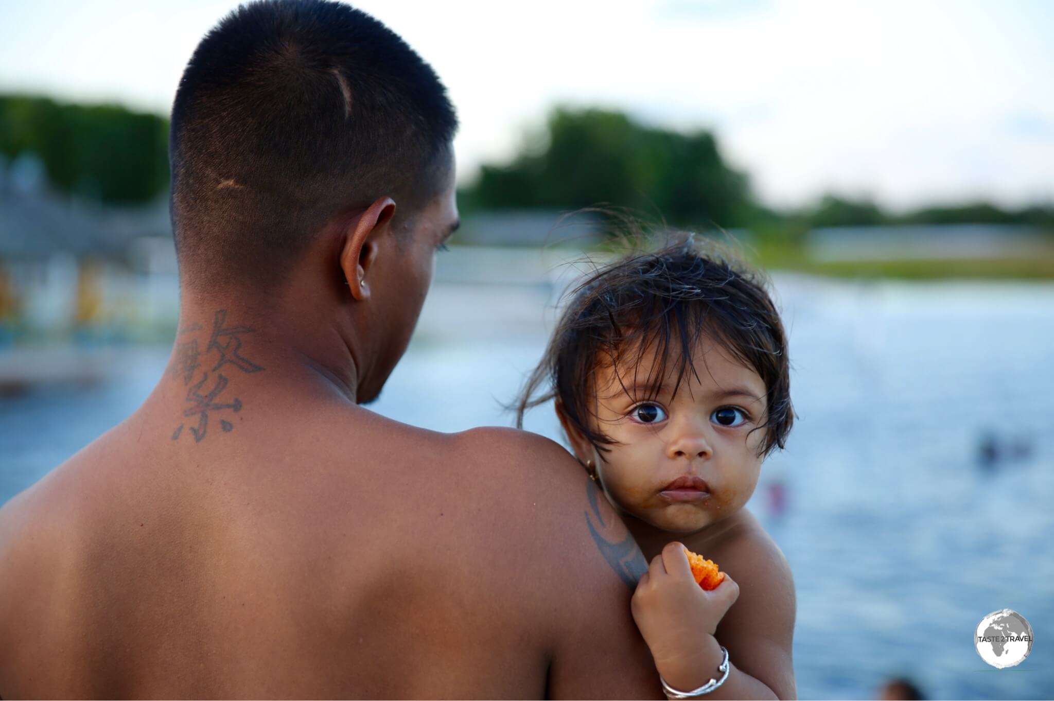 Father and daughter enjoying a sunset swim on beautiful Lake Capoey.