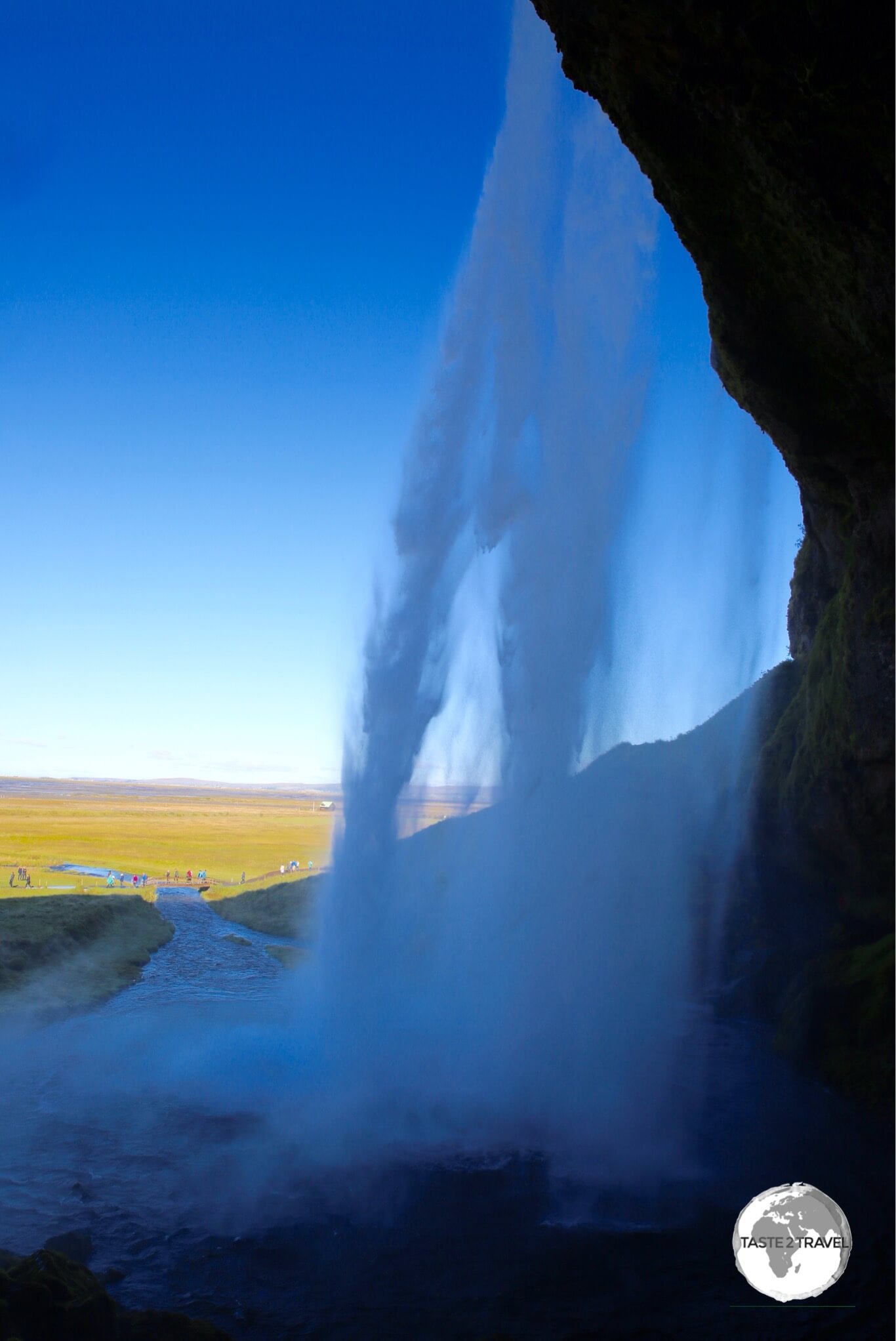 Behind Seljalandsfoss waterfall.