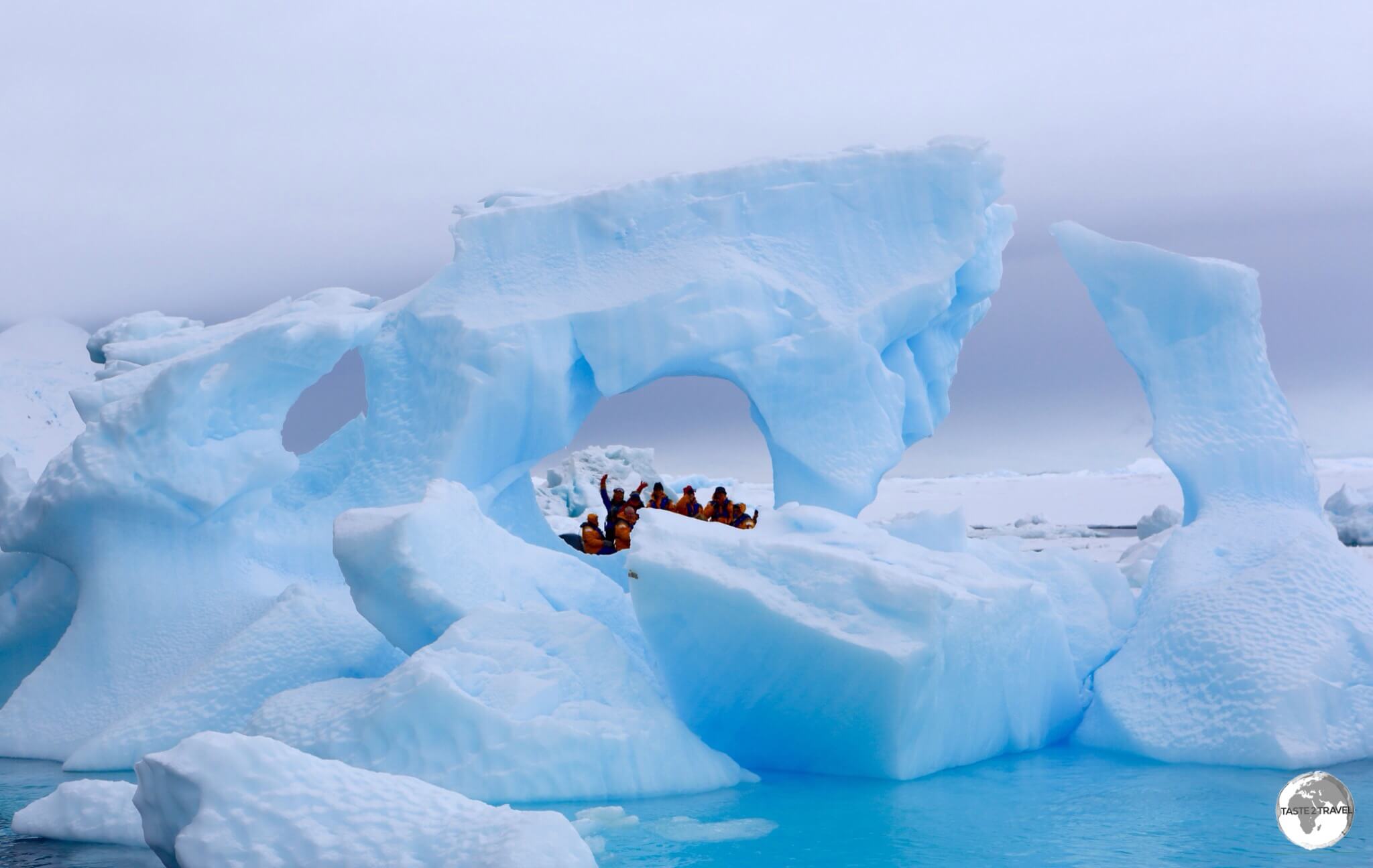 Zodiac cruising between icebergs on Crystal Sound.