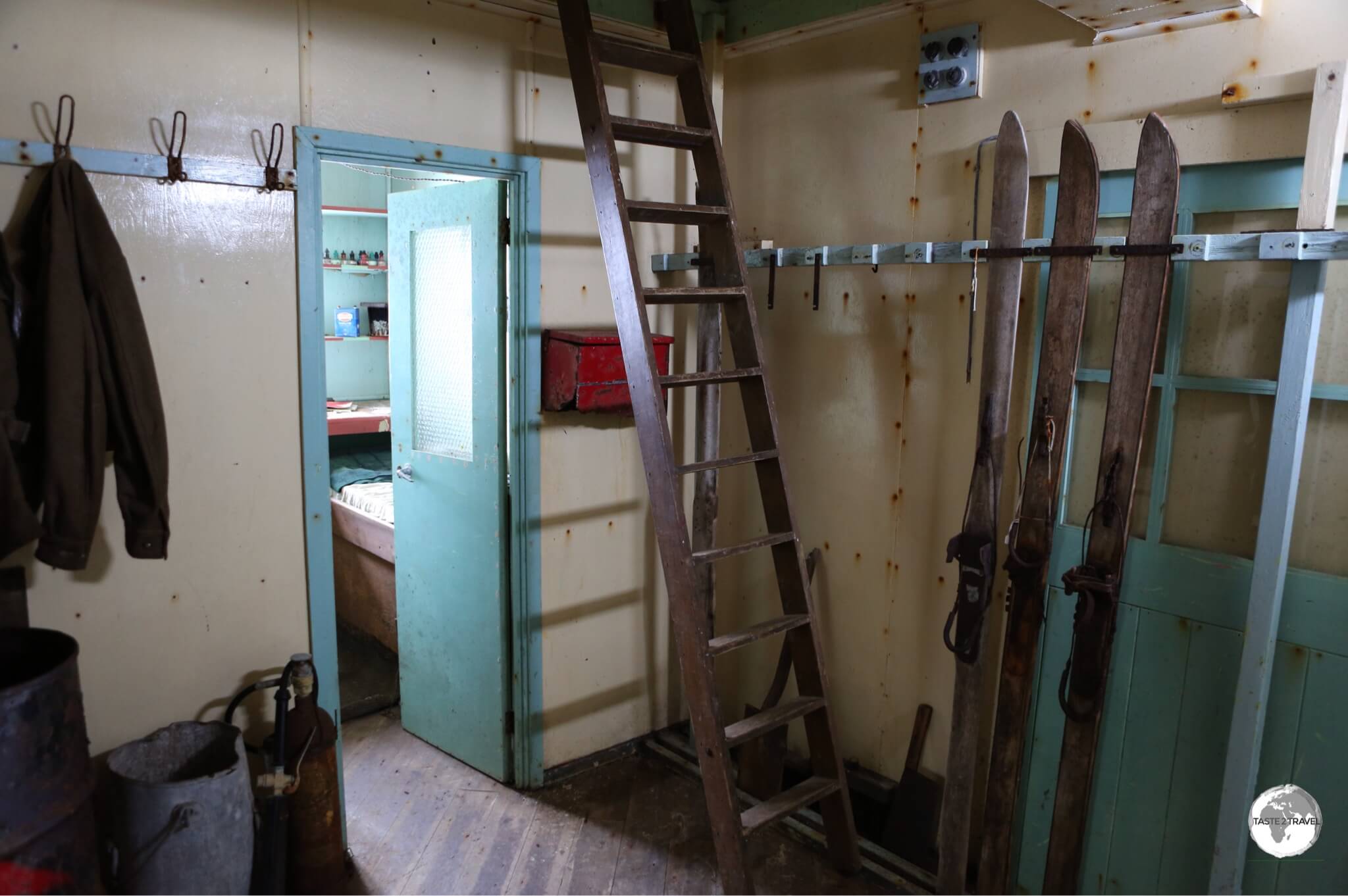 Skies and a coat remain on the racks in the entrance of <i>Base W</i> on Detaille Island.