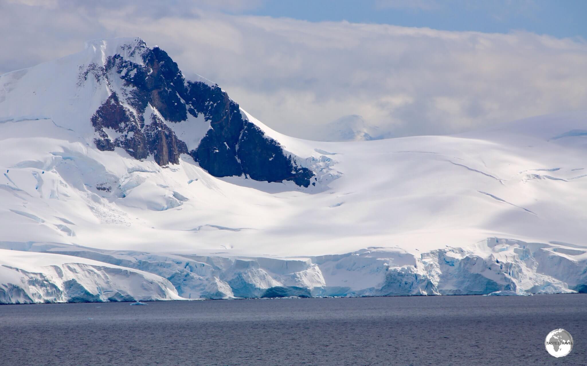 The view of Paradise bay, and the mountainous, glacier-covered Antarctic Peninsula, from <i>Base Brown</i>.