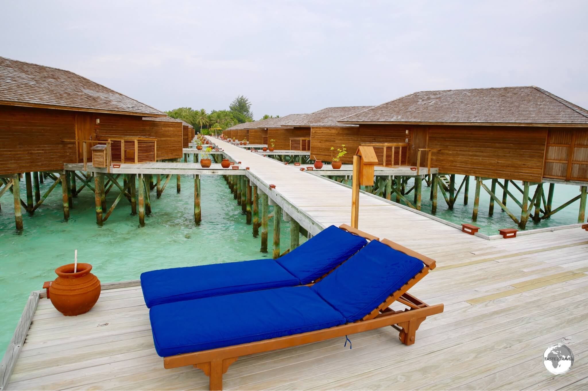 The 'Jacuzzi Water Villas' at Vilamendhoo Resort are accessed via an over-the-water boardwalk.