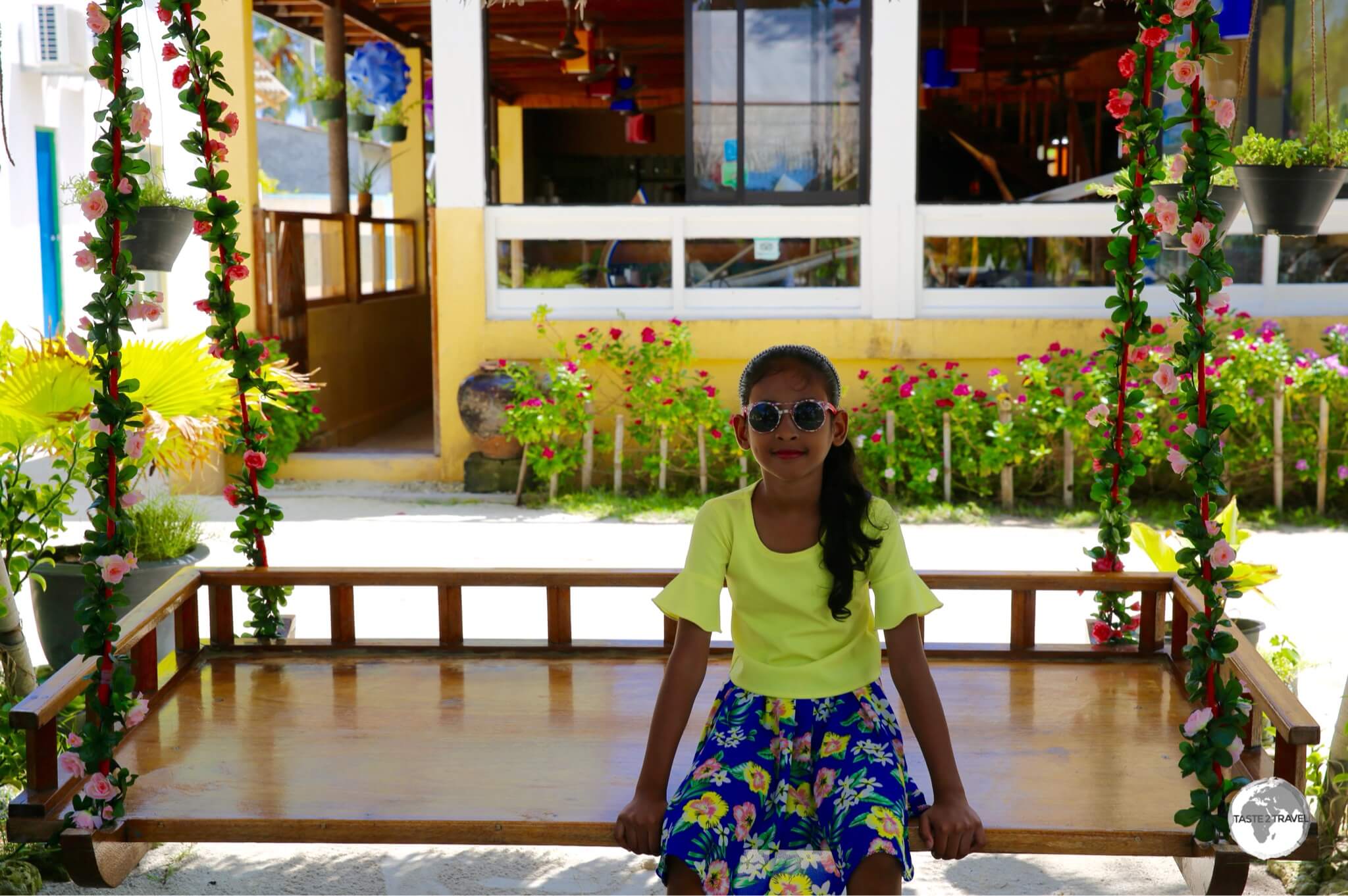 A young girl relaxing on Maafushi Island.