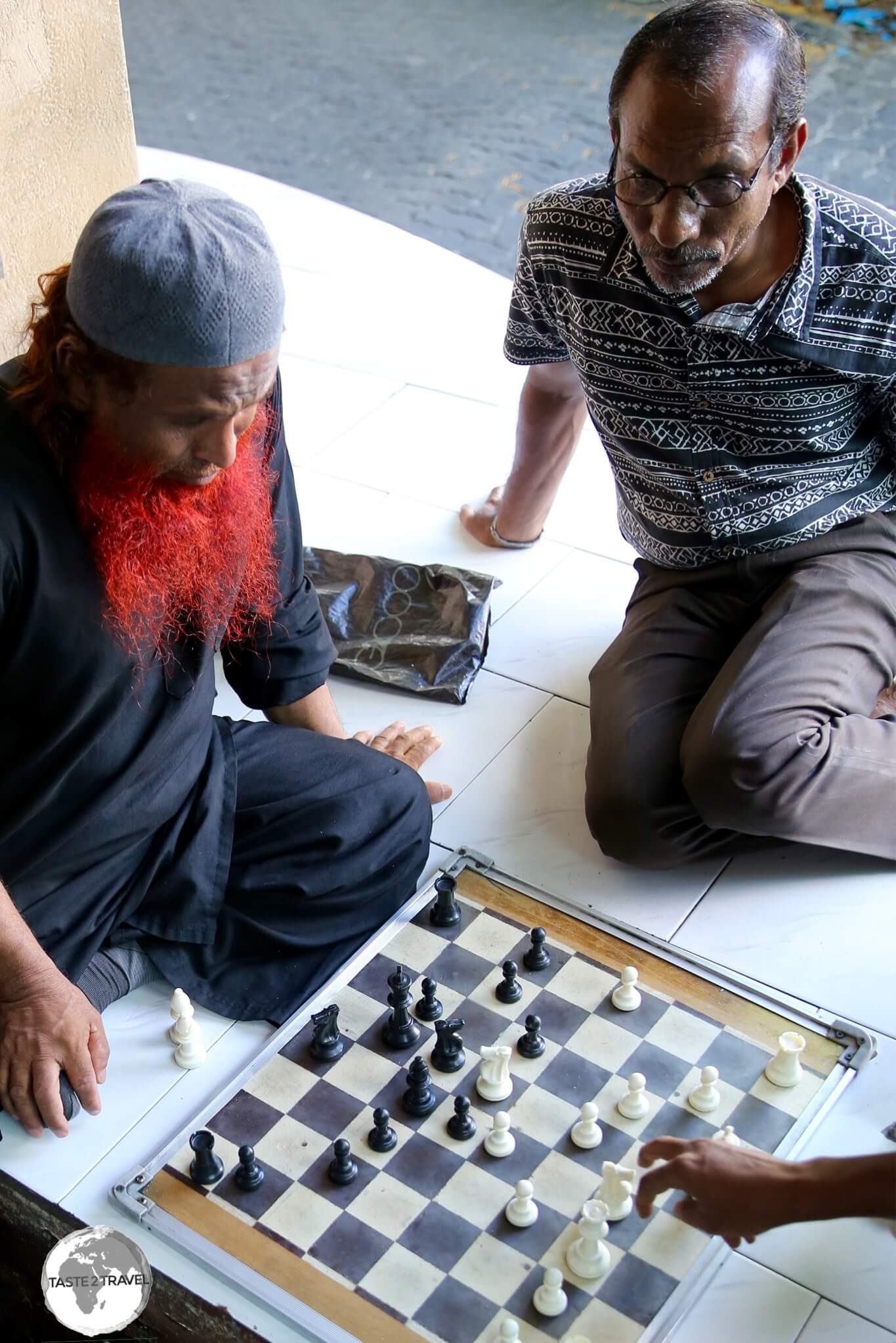 Locals playing Chess in a cafe in Malé.