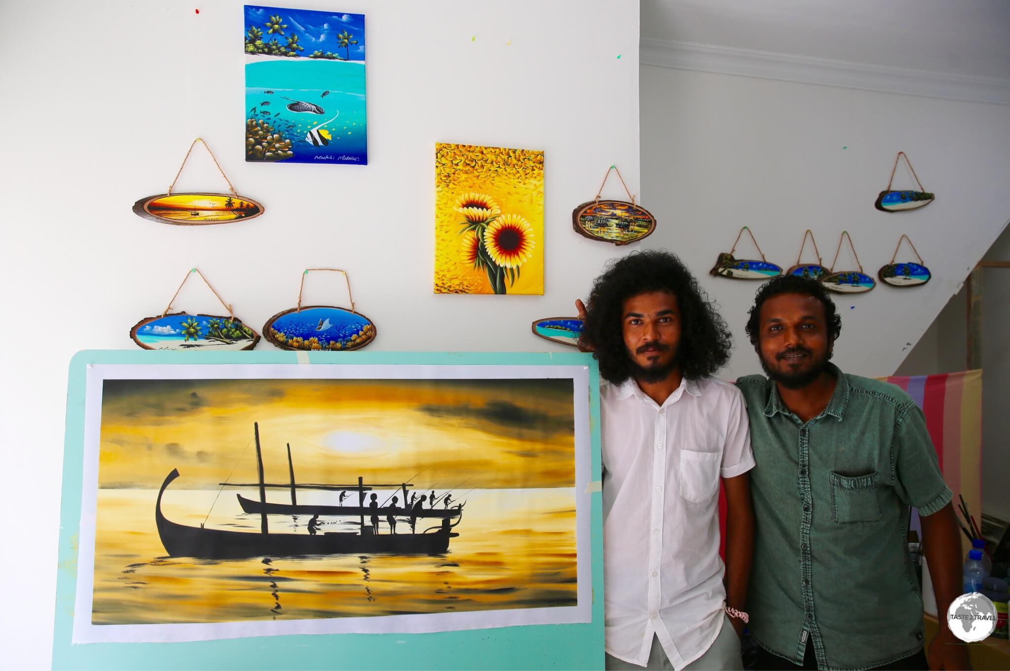 Local artist, Ibrahim Shinaz (right), in his studio on Maafushi Island.