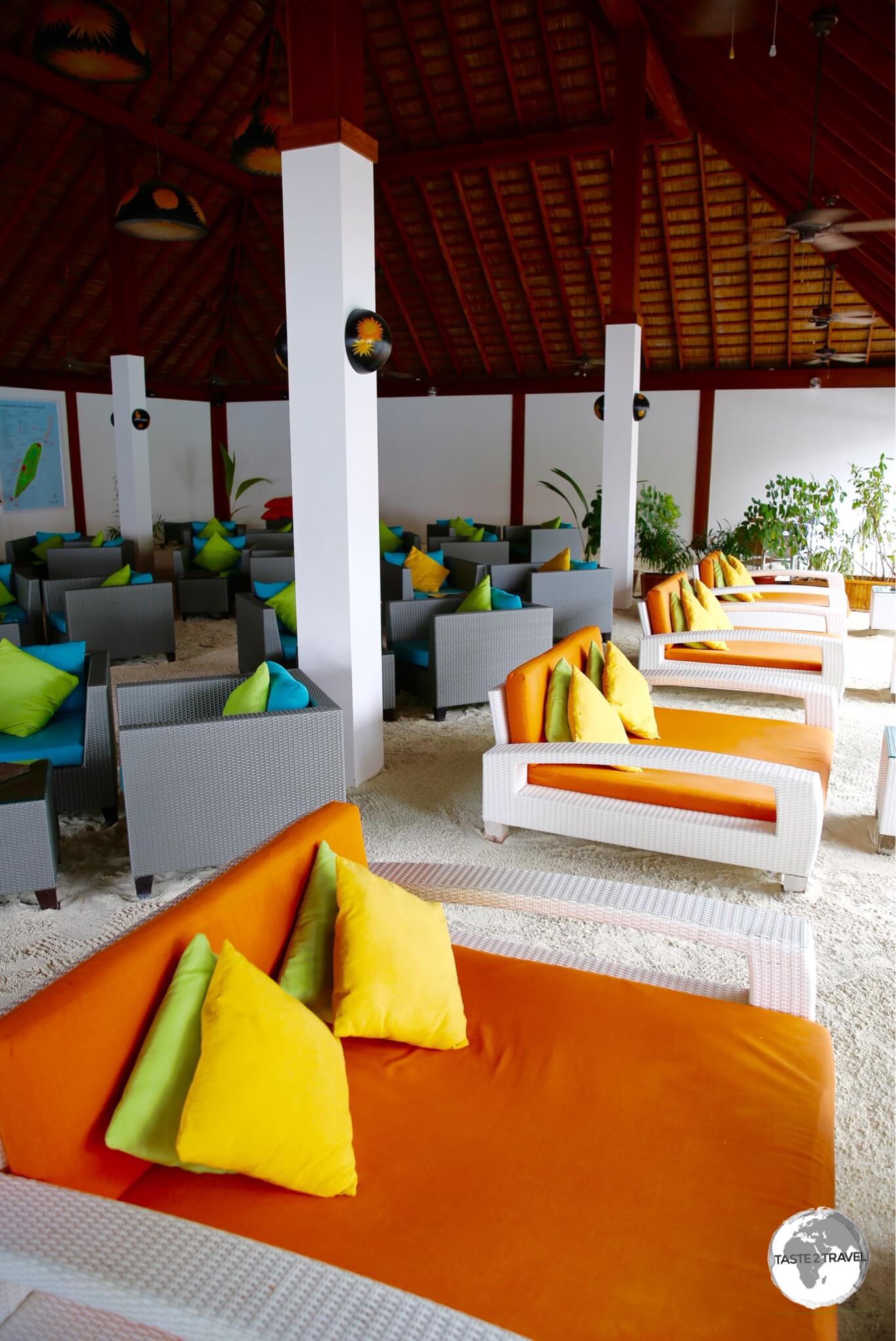 Comfortable lounges line the sand floor of the Sunset Bar at Vilamendhoo Resort.