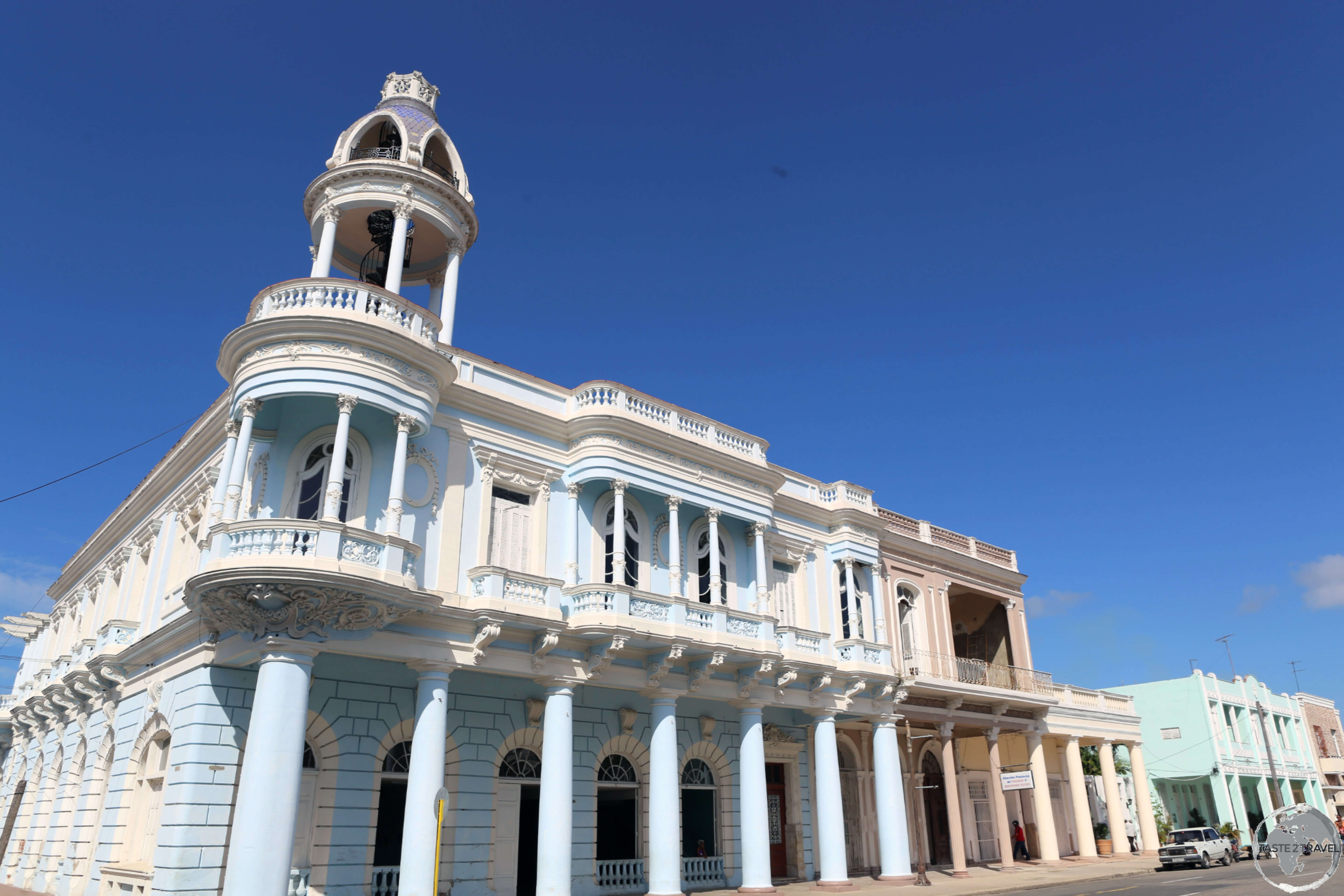 The neoclassical <i>Palacio Ferrer</i>, with its iconic cupola, overlooks Plaza Jose Marti in downtown Cienfuegos.