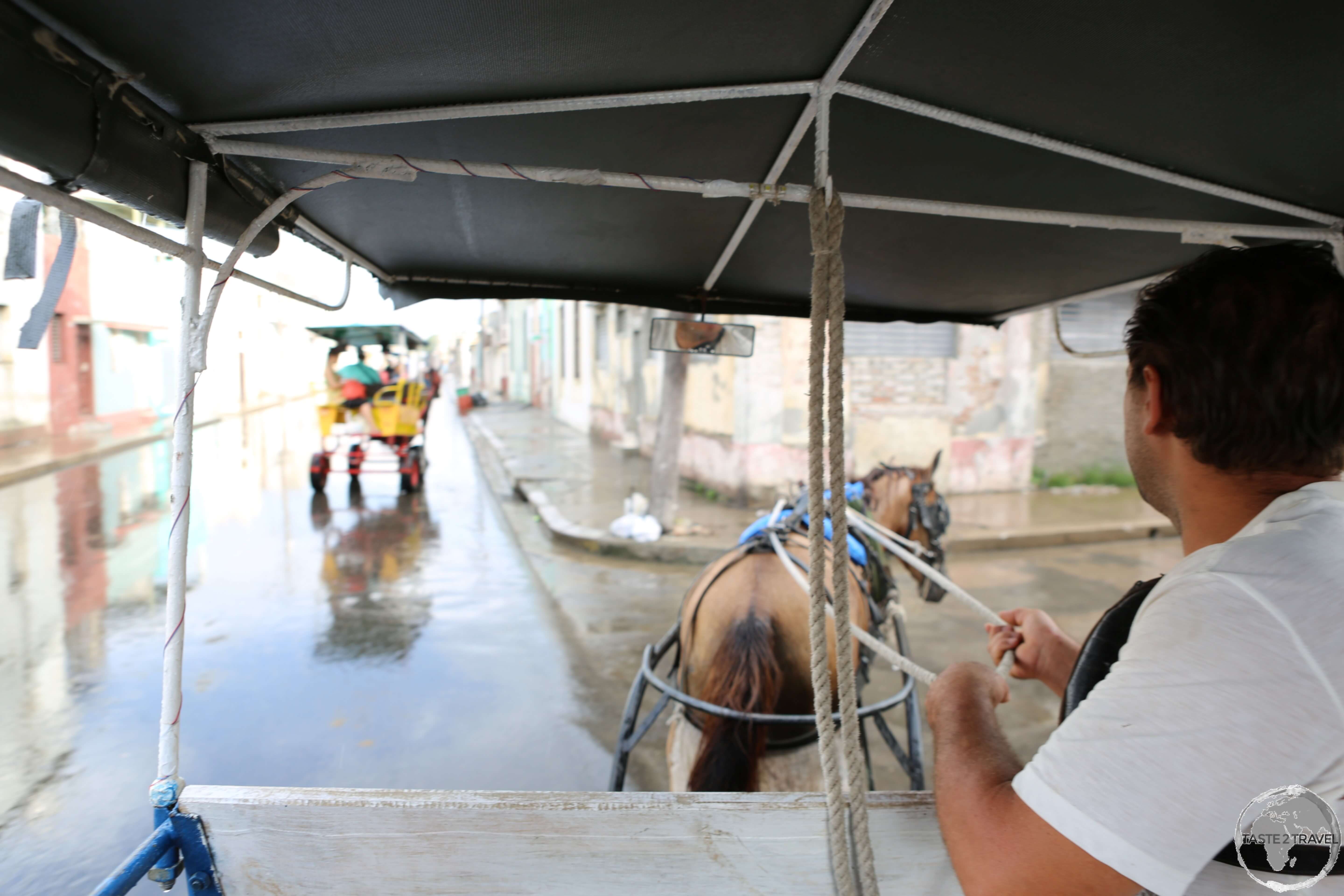 Touring Cienfuegos in my horse carriage.