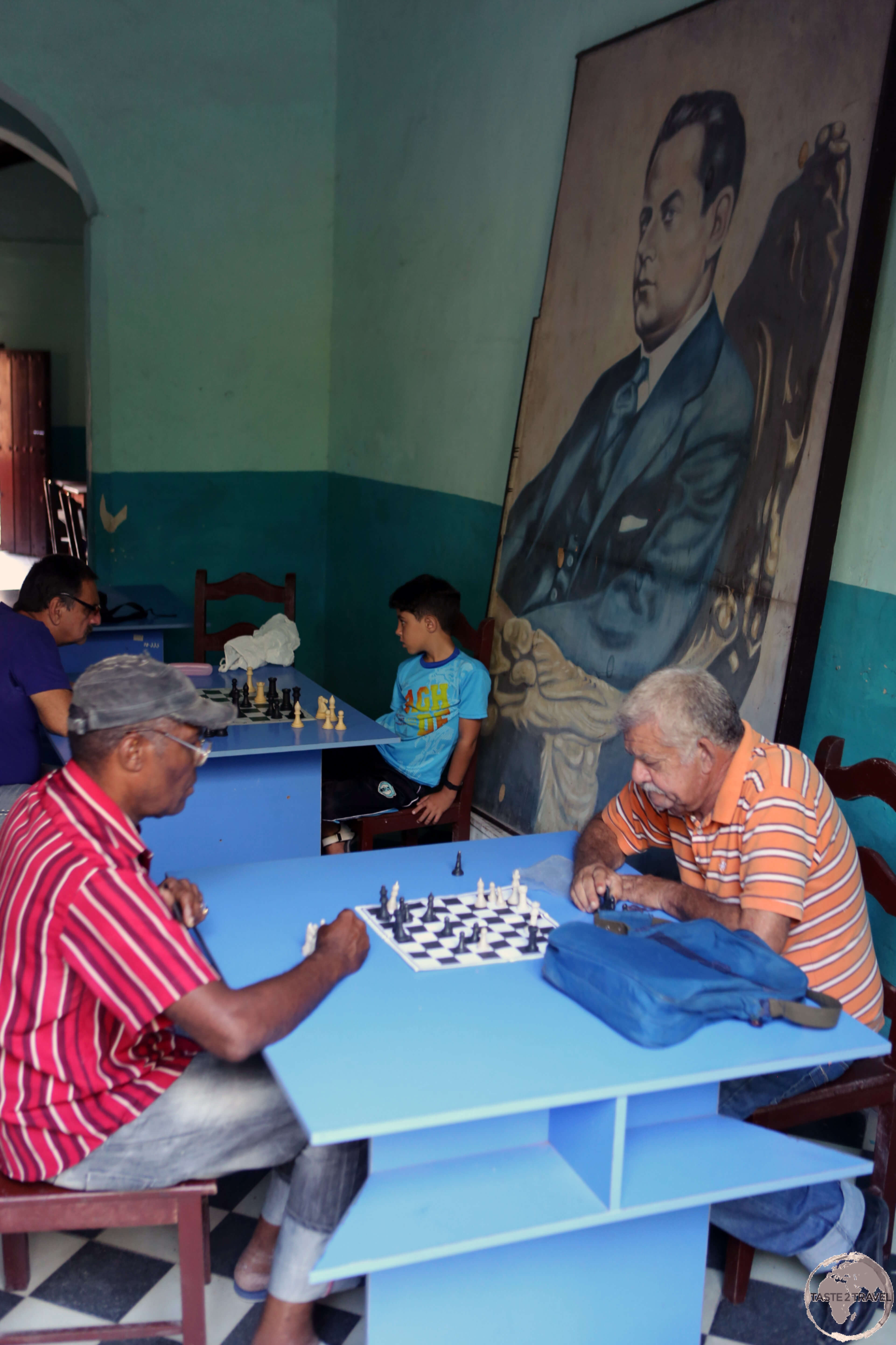 Playing chess in an old town cafe in Camagüey.