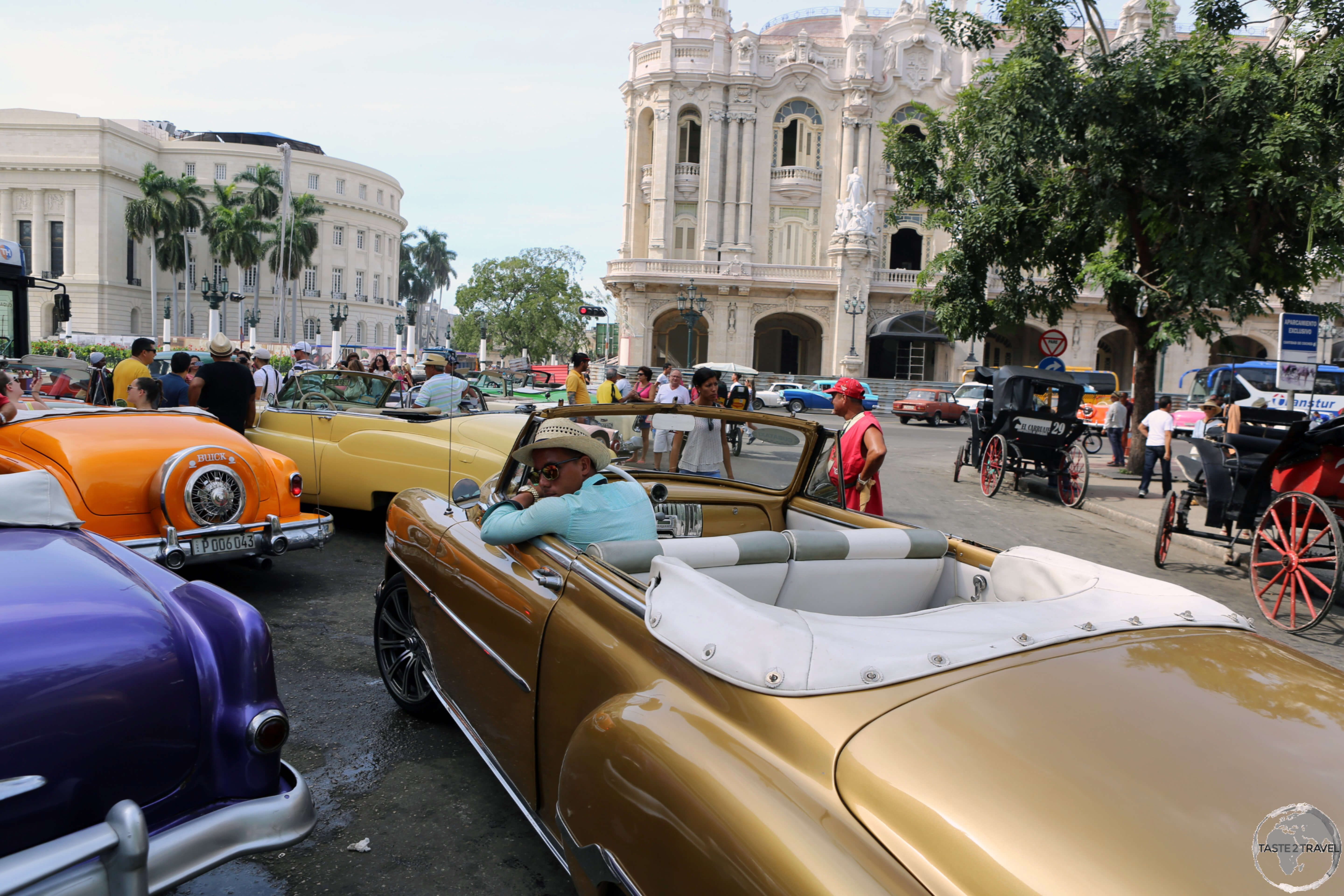 Pick your colour! American classic car taxi's available for hire at Parque Central in Havana old town.