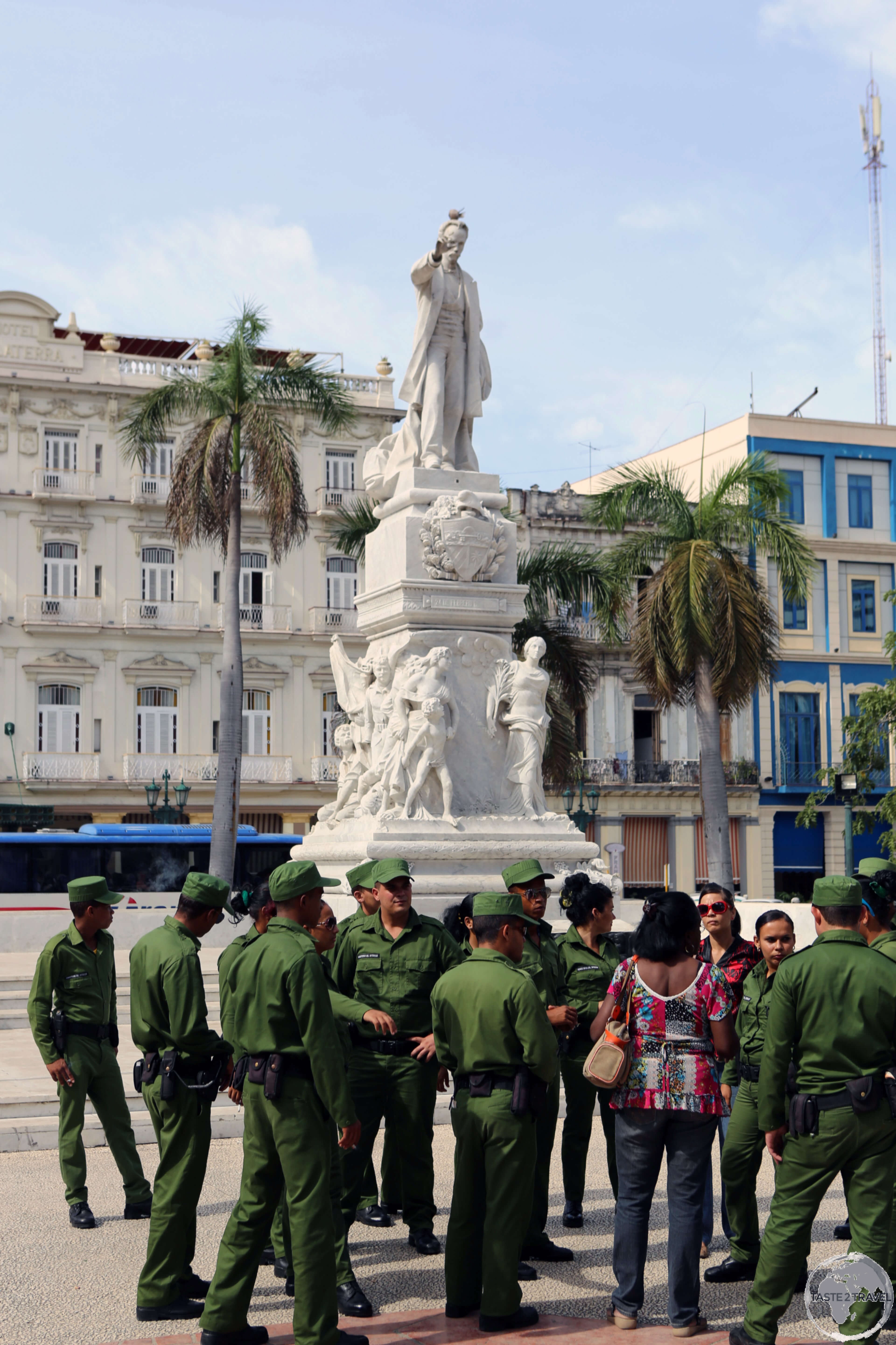 Soldiers visiting a statue of José Martí in Parque Central in Havana.