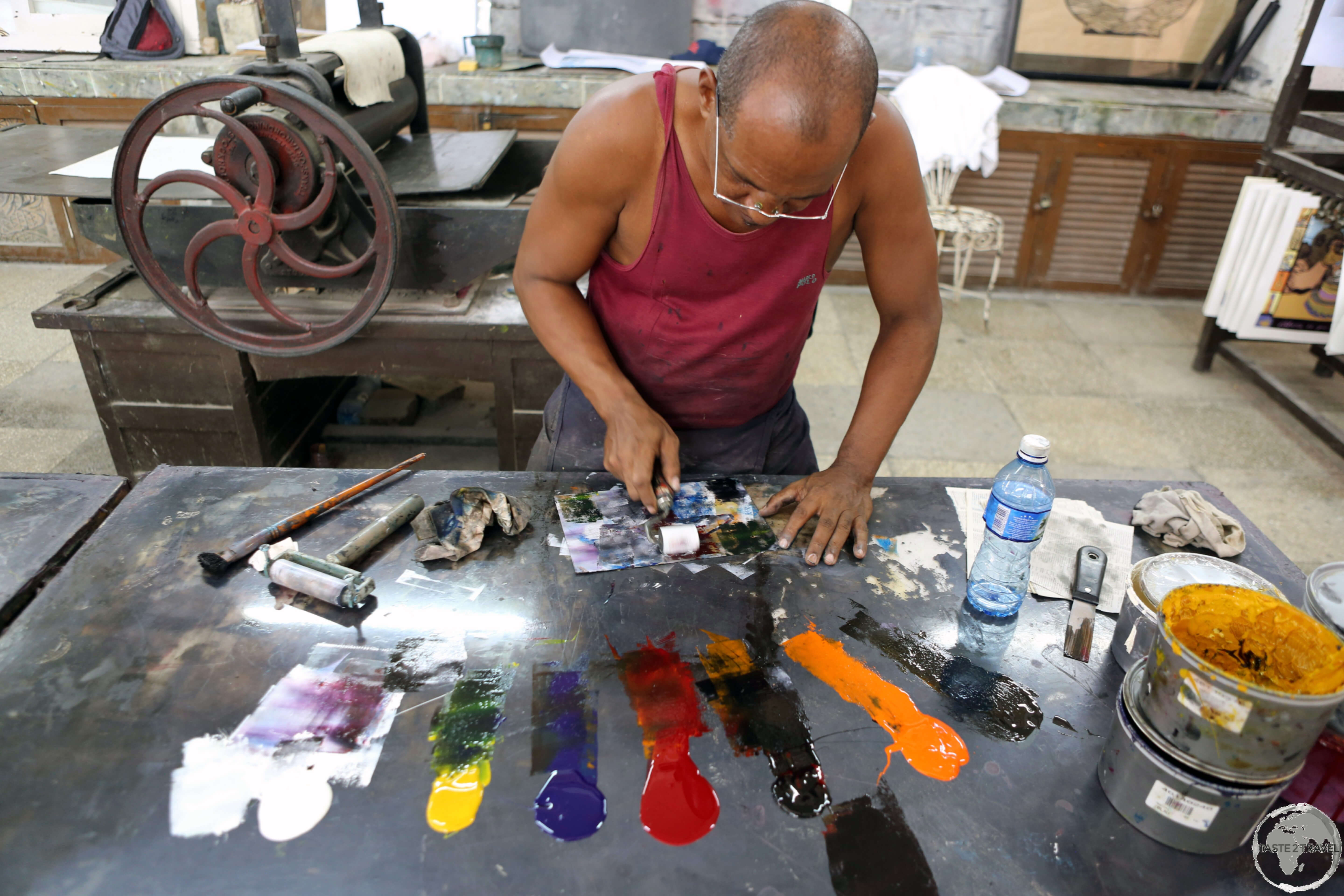 An artist preparing his next masterpiece at the <i>Taller Experimental de Grafica</i> in Havana old town. 