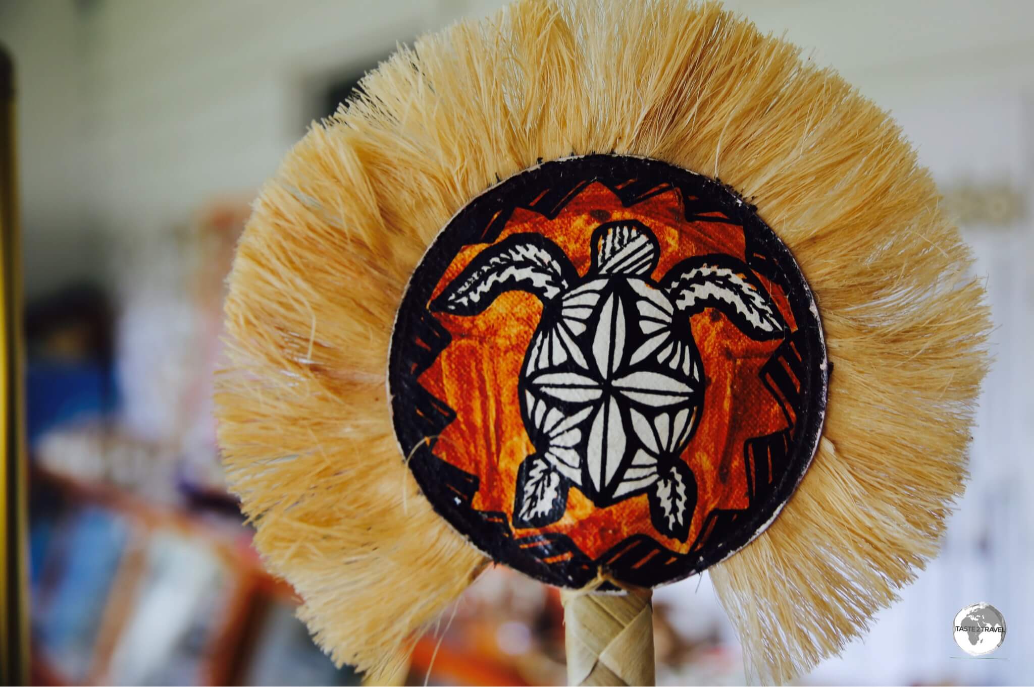 Hand-painted Tapa fans are popular souvenirs.