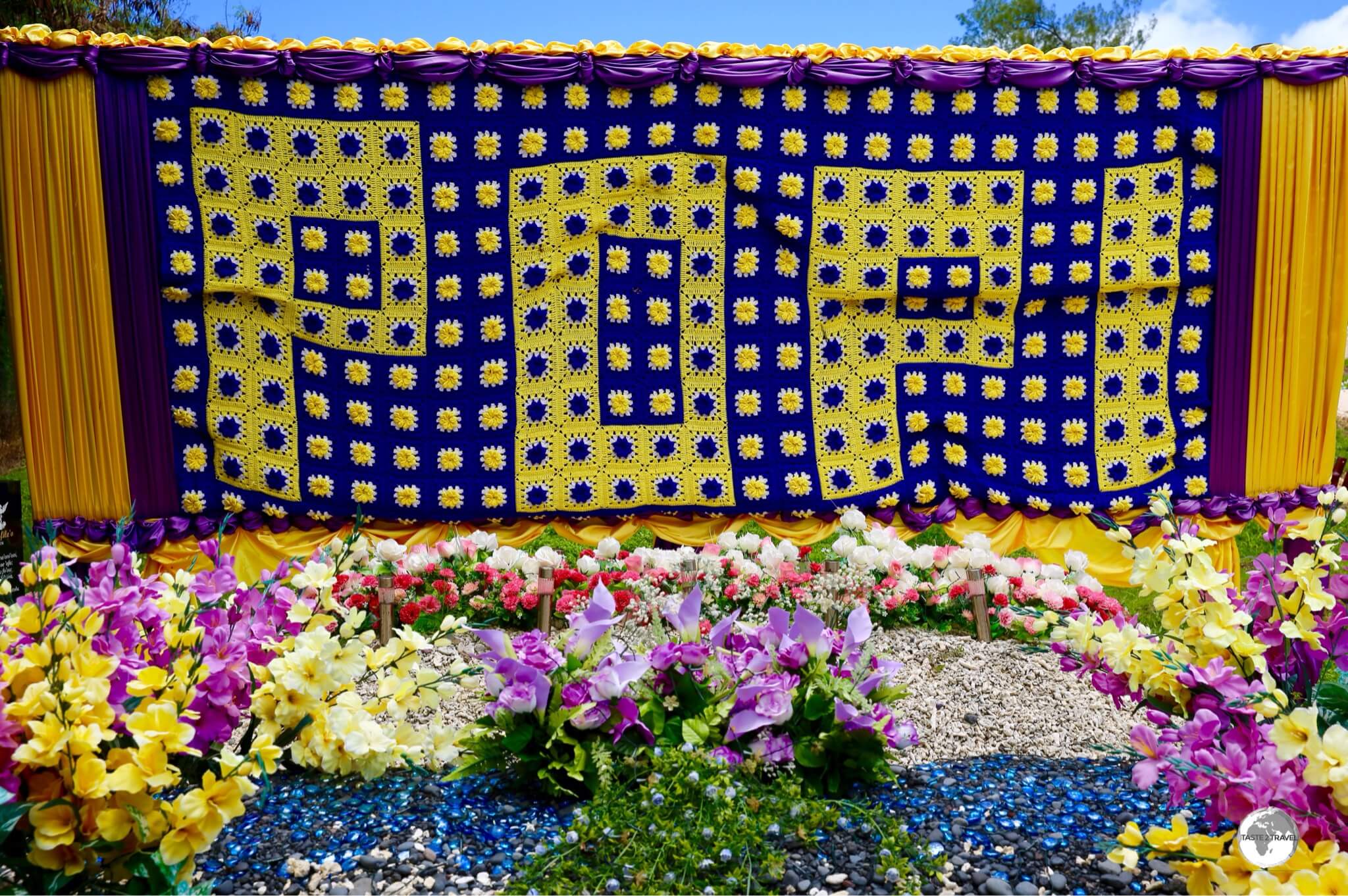 Dedicated to 'Popi', this huge gravestone banner is comprised of many small, hand-crochet squares.