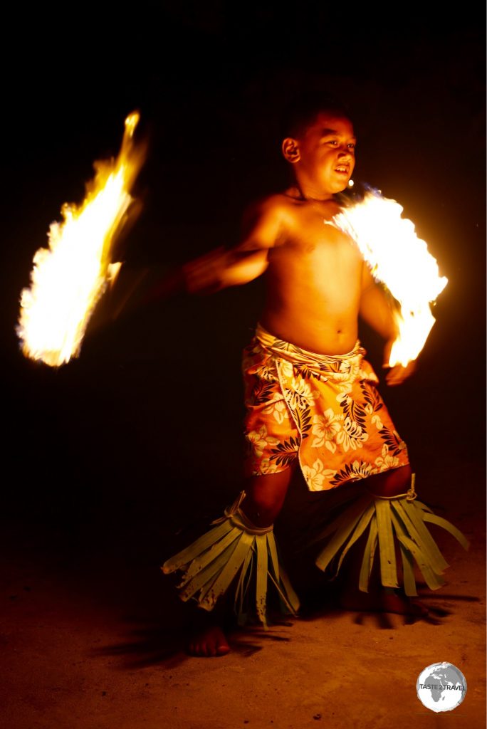 A Fire dance performer at Hina Cave.