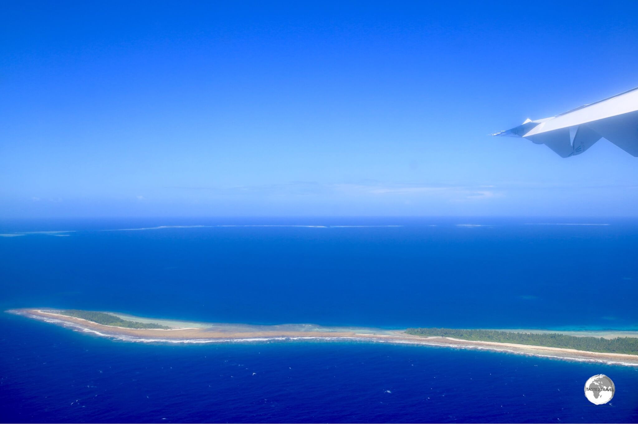 A view of Tuvalu from my Fiji Airways flight. The thin, flat atolls are slowly being inundated due to rising sea levels.