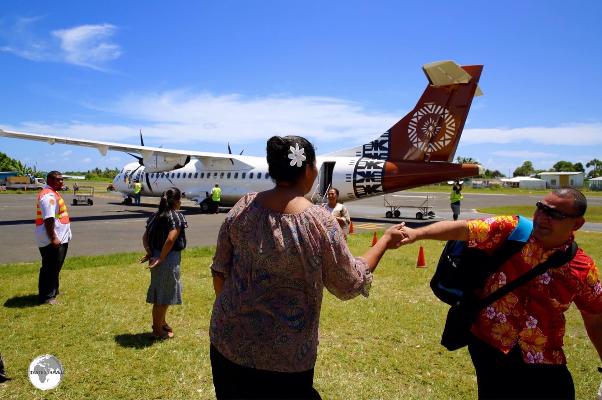 Passengers, almost always returning locals, arriving at Funafuti International airport.