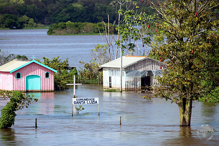 Known as the "River Sea", the Amazon River inundates riverside villages, such as Santa Luzia, during the annual wet season.