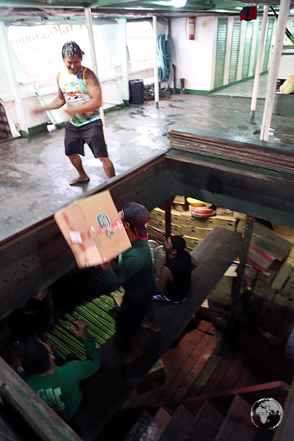 The crew of the MV Amazonia loading freight into the hold at Santarém.