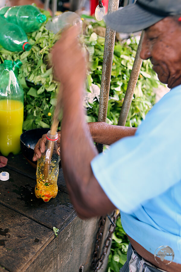 Preparing a fiery pepper sauce at the 'Ver-o-Peso' market in Belém.