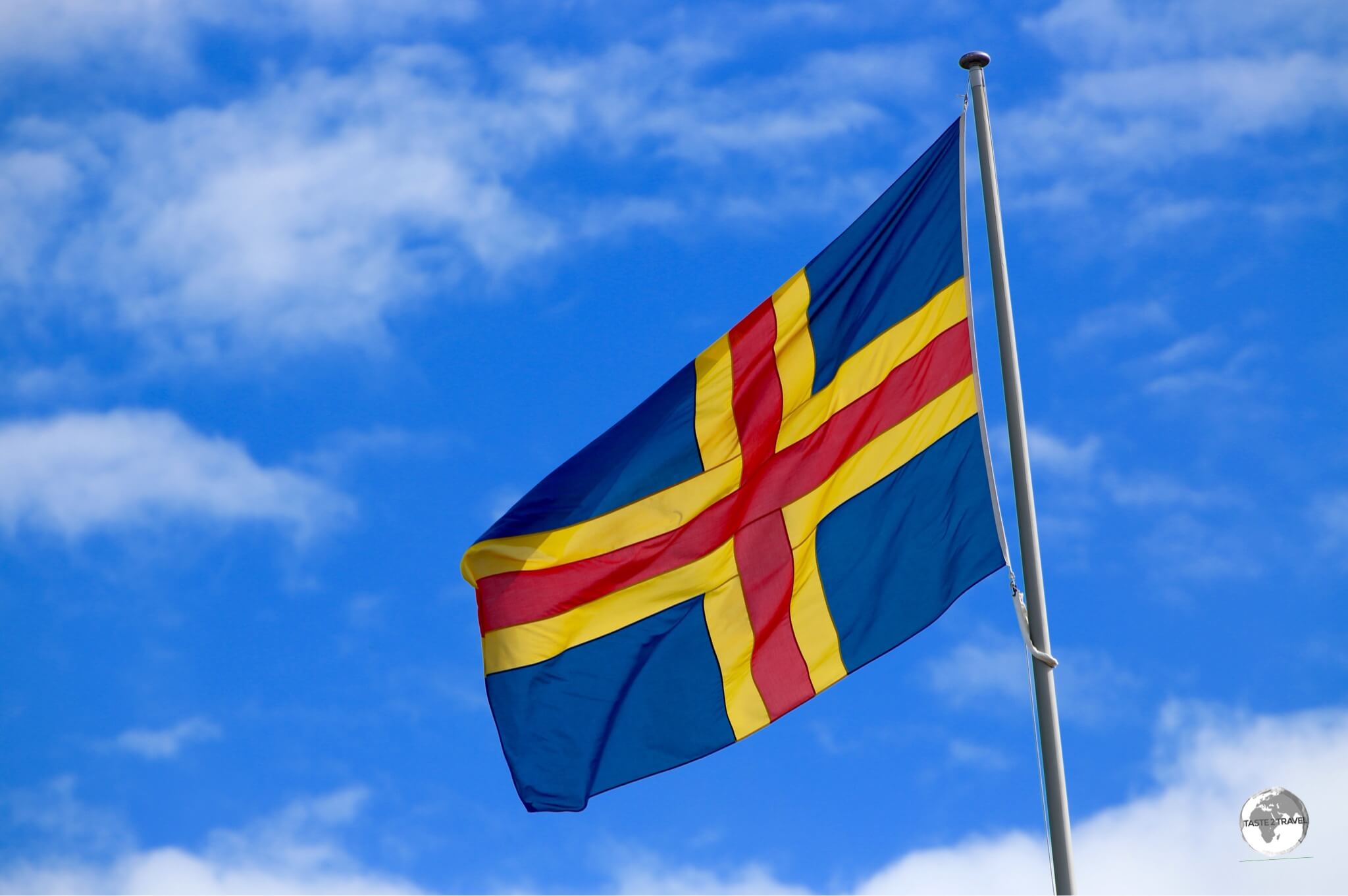 The flag of the Åland Islands flying outside parliament in Mariehamn. 